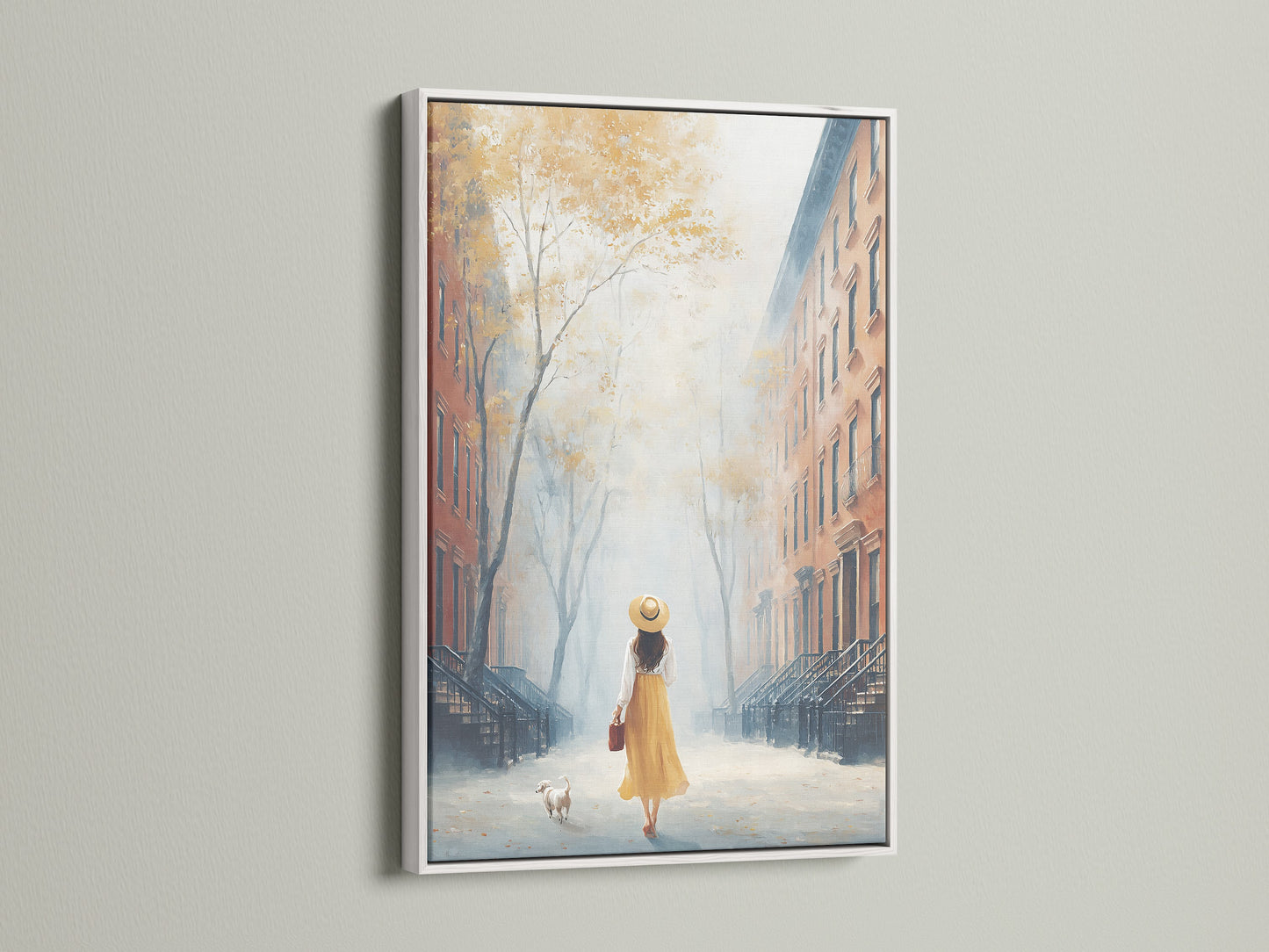 City Street artwork in a white frame. The artwork features a woman walking with her dog in an urban setting. The white frame enhances the artwork's contemporary style. This artwork would be perfect for minimalist decor styles.