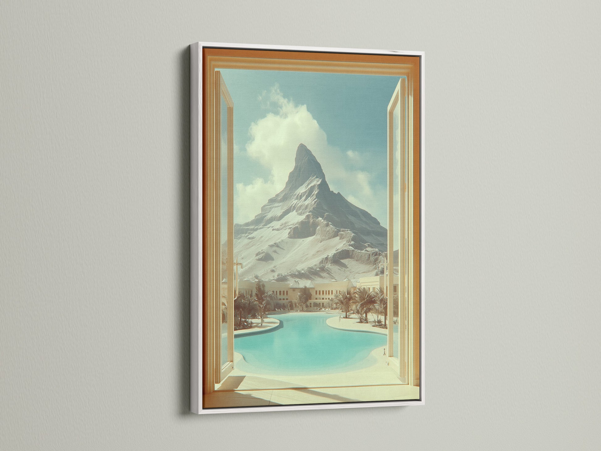 White frame featuring mountain view artwork. This artwork creates an open window effect to a desert oasis. Ideal for living room wall art or office wall art. This travel scenery print adds vacation vibes to any space. Bring scenic artwork into your home.