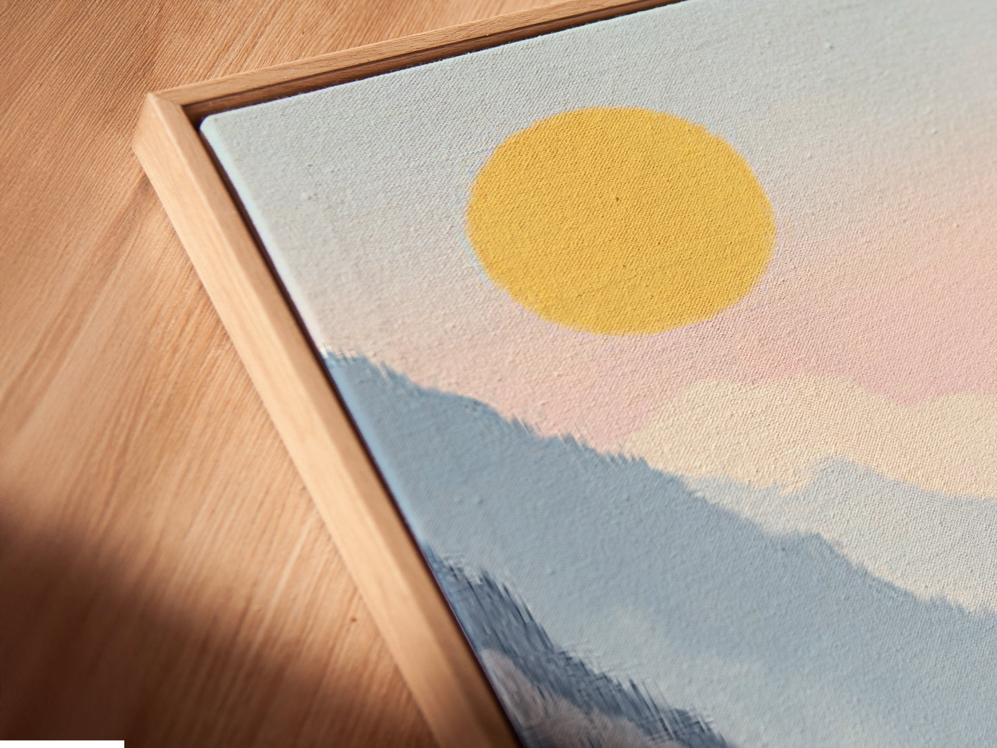 A close-up angled view reveals a canvas print in a floating frame. The mountain lake artwork exudes serene beauty. This valley wall art enhances any space with its pastel landscape. Perfect for adding a modern touch to your office or home decor. Discover tranquil art.