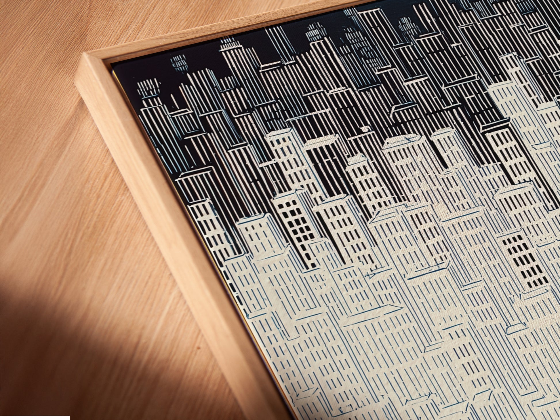 A close-up angled view reveals a canvas print in a floating frame. The floating frame enhances the artwork's presence. Perfect for modern wall decor. This cityscape artwork is a stunning addition. The minimalist building print complements urban art.