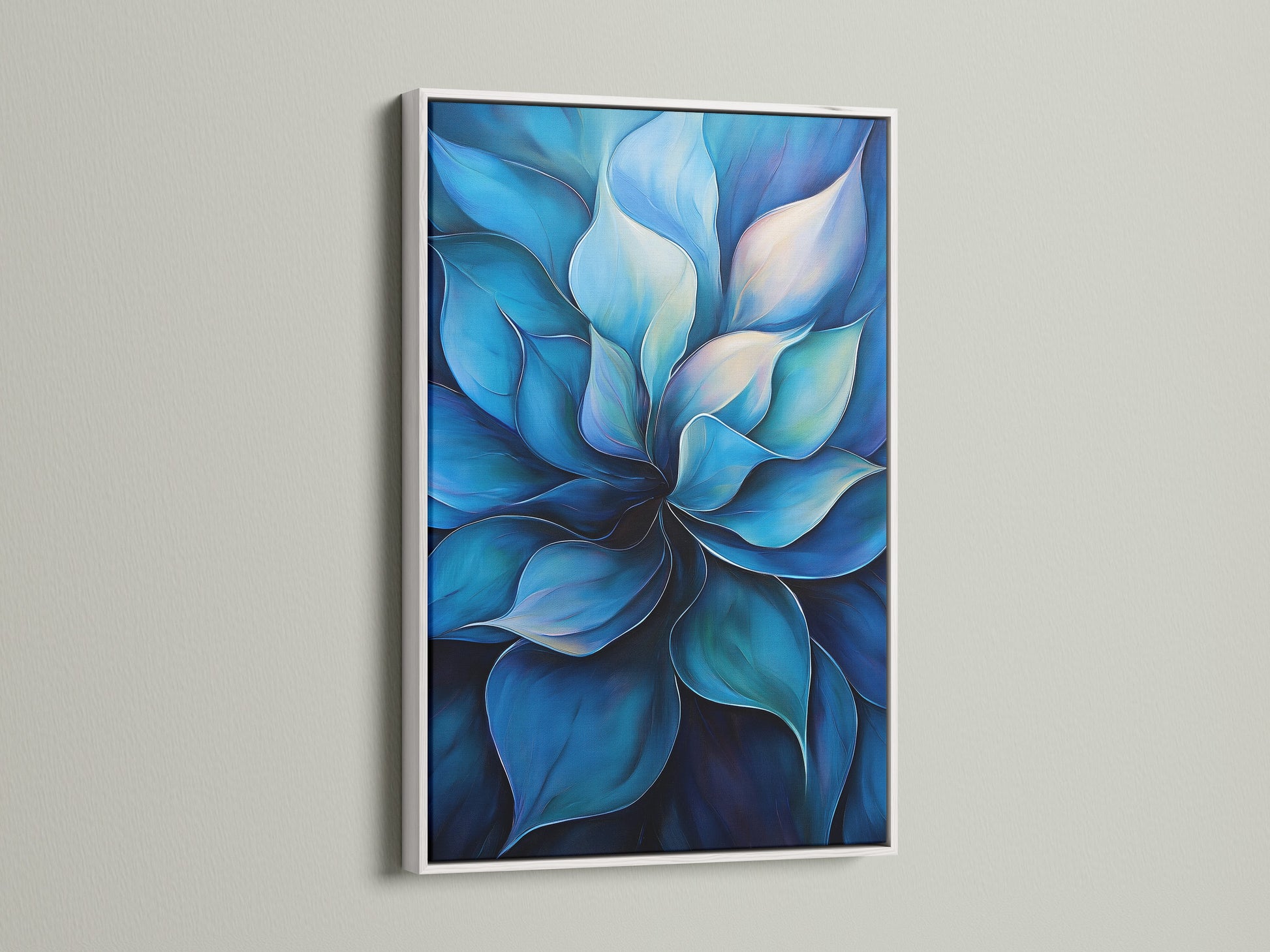 A blue flower artwork is displayed within a white frame. The white frame enhances the art's vibrant colors. This botanical canvas print brings a fresh modern look to any room. It is a great choice for homeowners seeking contemporary art. It suits minimalist coastal styles and is perfect for bedroom wall decor.