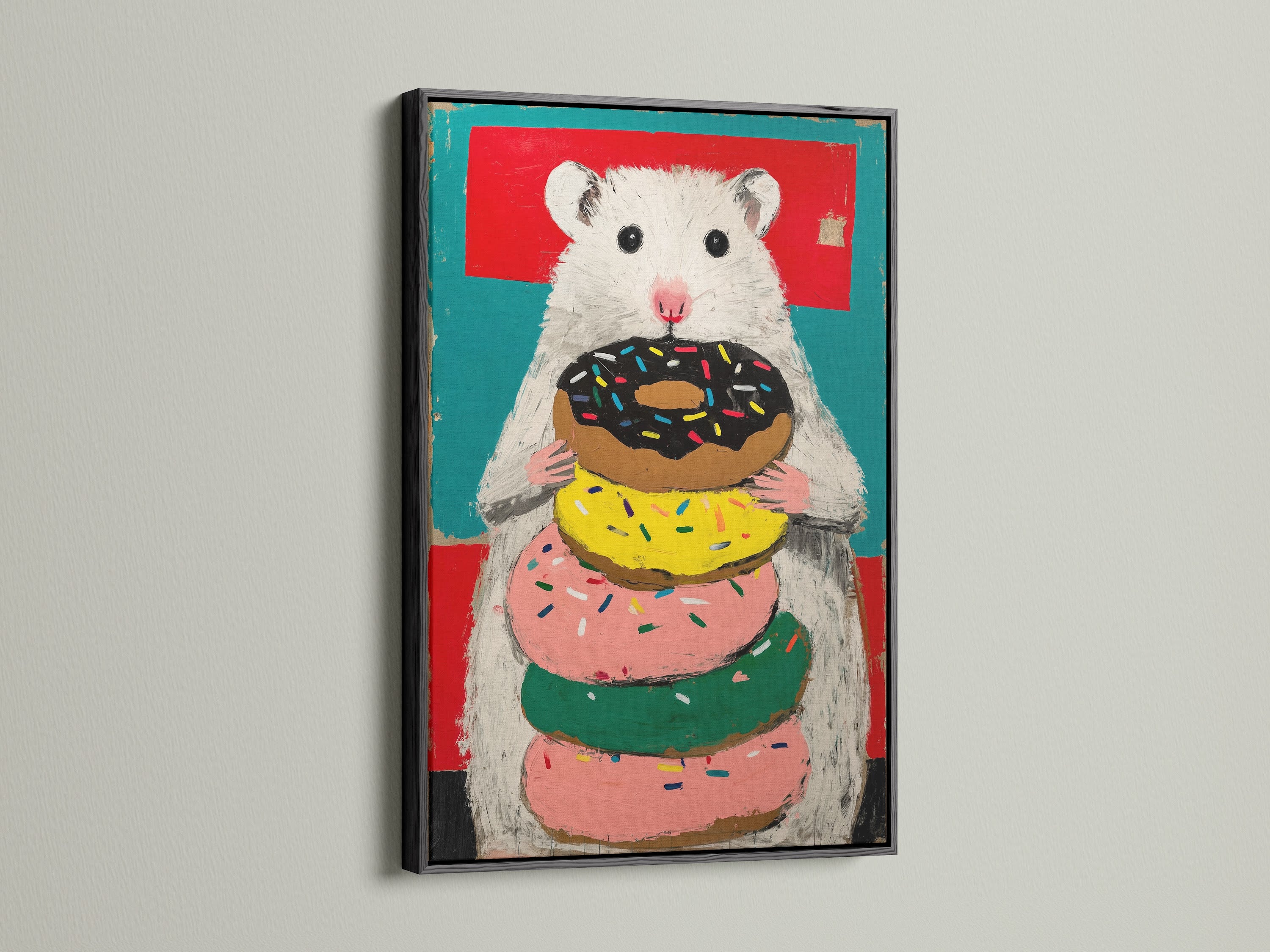 Hamster with Donuts artwork in a black frame. The artwork features a stack of donuts. This colorful wall art will brighten your space. The secondary color is green.