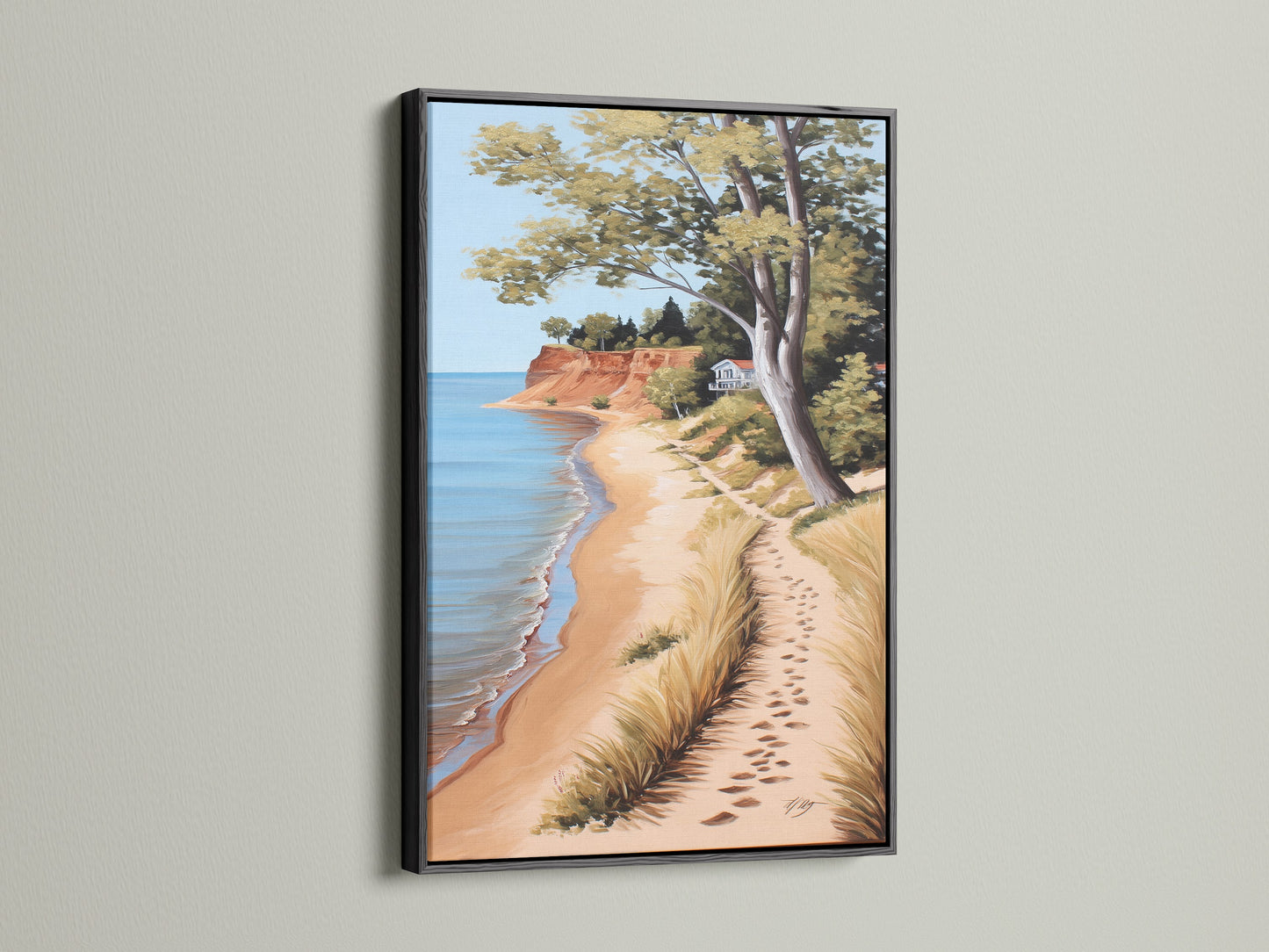 Coastal Beach Canvas Artwork in a Black Frame. The serene ocean view print showcases a sandy shoreline. Perfect coastal wall art for a beach house. Bring the calming essence of the coast to your living room or bedroom with this beautiful piece.