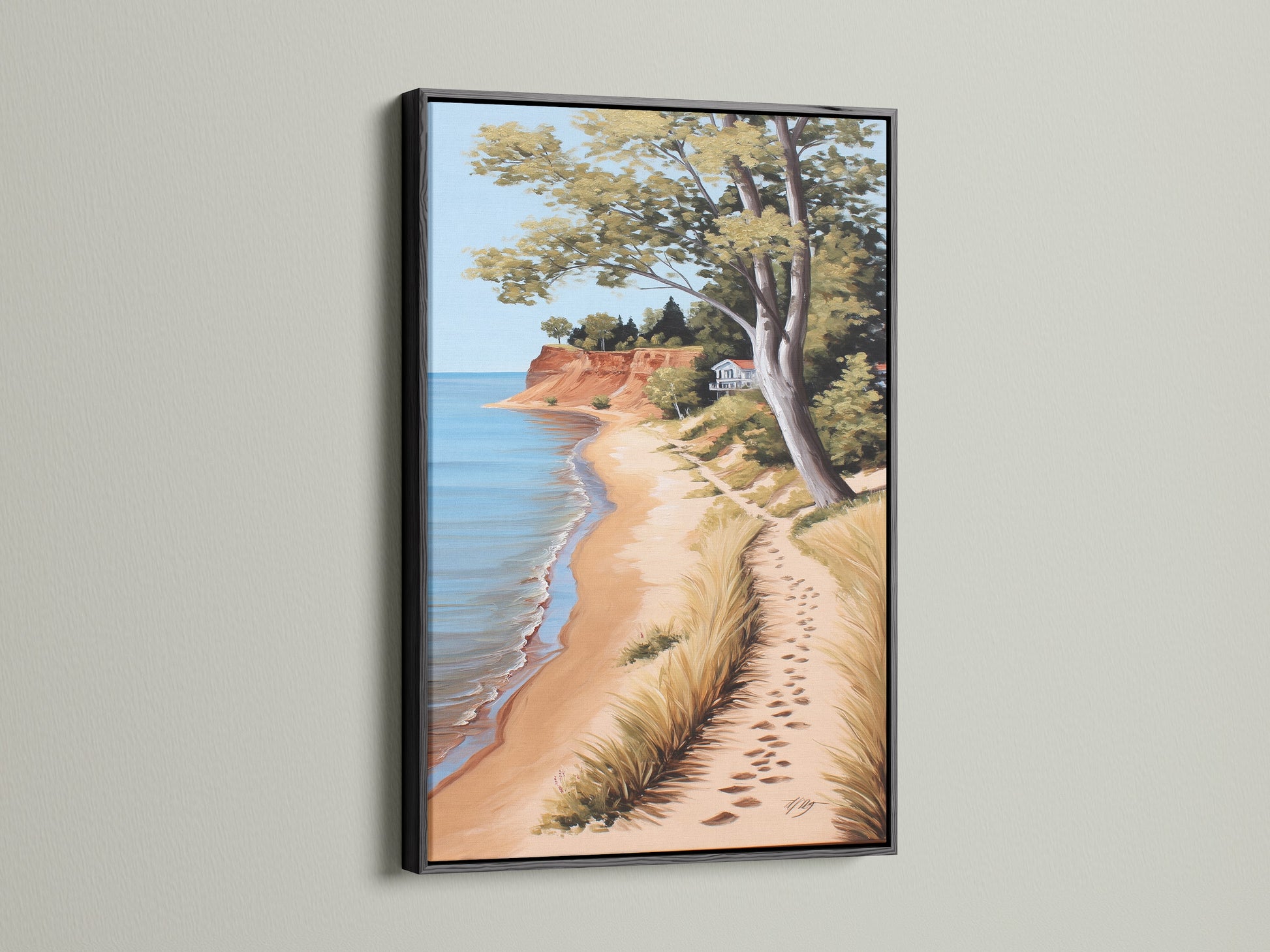 Coastal Beach Canvas Artwork in a Black Frame. The serene ocean view print showcases a sandy shoreline. Perfect coastal wall art for a beach house. Bring the calming essence of the coast to your living room or bedroom with this beautiful piece.