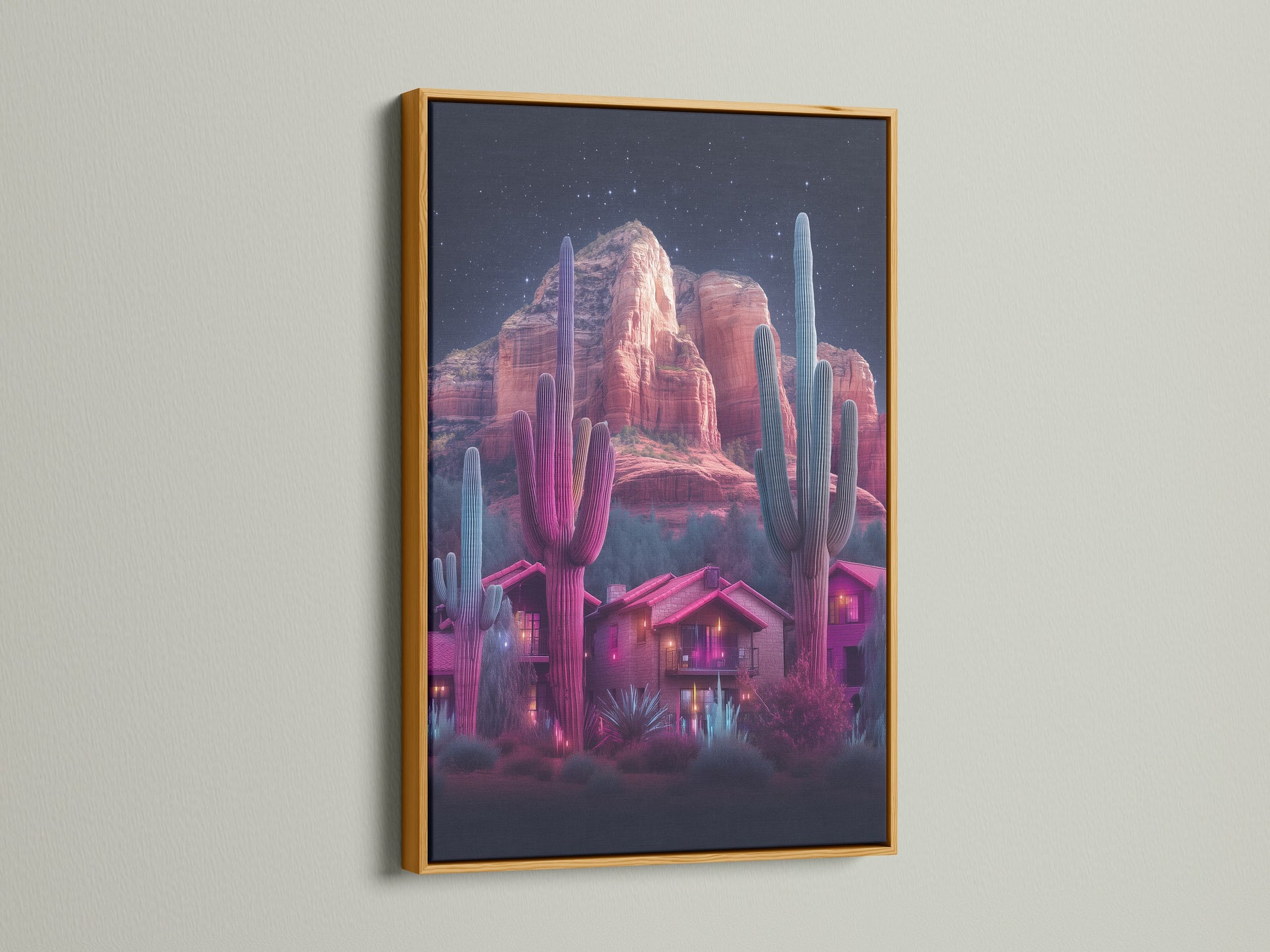 Neon cactus artwork featuring a desert landscape inside a gold frame. The artwork showcases a southwestern scene with vibrant pink and teal hues. This vibrant wall art brings desert vibes to any space. Perfect for southwestern decor and modern homes.