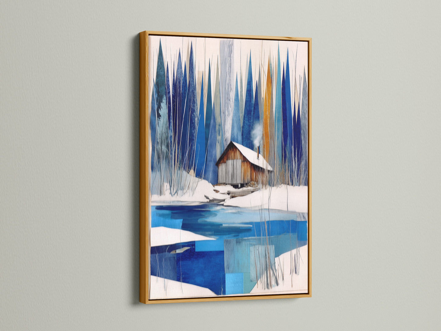 Winter Cabin Canvas Artwork with a gold frame. This artwork features snowy lake wall art to enhance chalet decor. The gold frame adds a touch of luxury to the blue and white abstract winter art. Perfect for modern wall art enthusiasts and nature print collectors. Suits lake house decor and cozy home art.