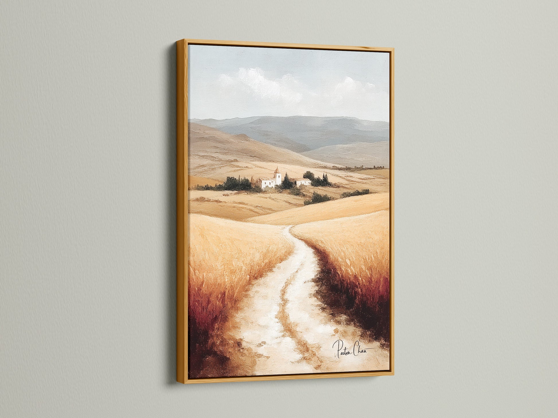 Tuscan Landscape artwork with a gold frame. This Italy countryside wall art brings a touch of luxury to your home. The neutral tone art complements the farmhouse decor. Italian scenery showcases a beautiful wheat field. Add rustic wall art to your dining area with this scenic canvas.