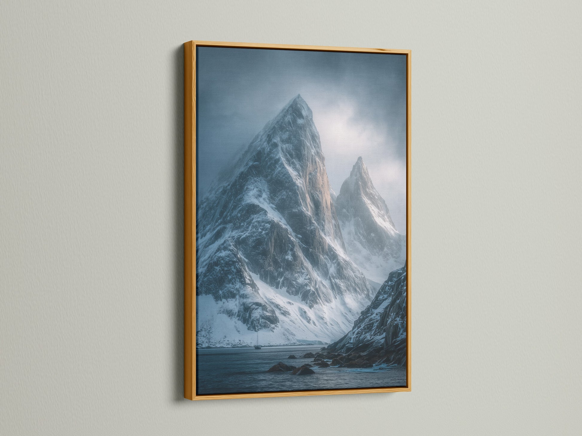 Add a touch of luxury with this gold frame. This mountain peak canvas print features snowy landscape wall art. The moody blue photography creates a serene atmosphere. Perfect for upscale modern decor.