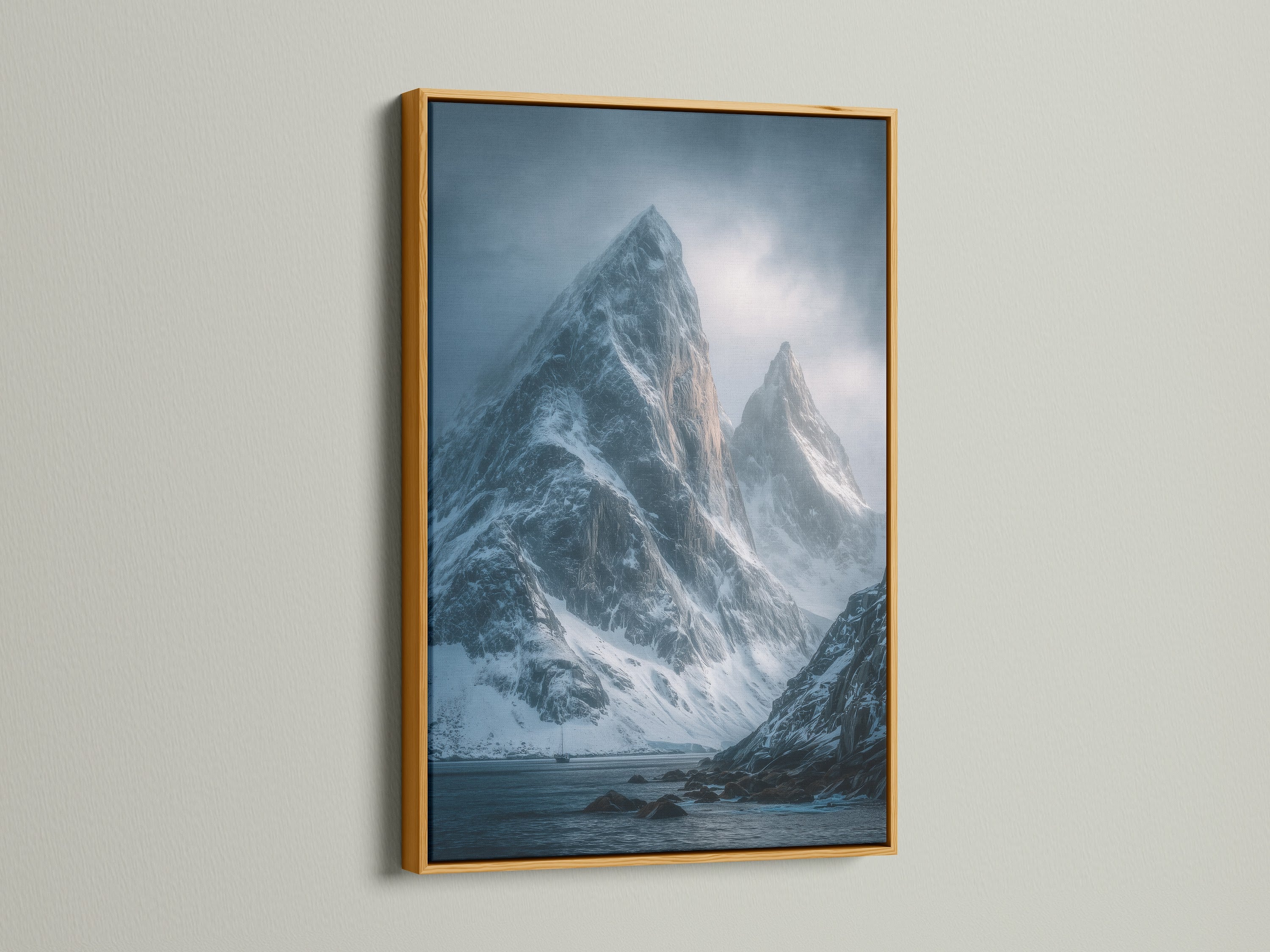 Add a touch of luxury with this gold frame. This mountain peak canvas print features snowy landscape wall art. The moody blue photography creates a serene atmosphere. Perfect for upscale modern decor.
