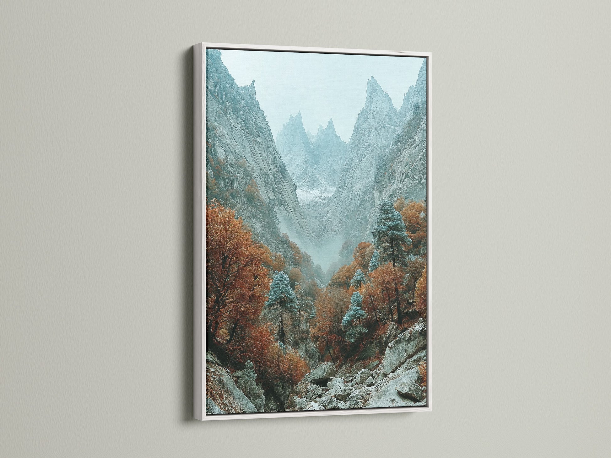 Scenic canyon art in a white frame. The mountain valley artwork showcases a misty autumn landscape. This nature photography adds a serene touch to your office or home. The white frame complements the art.