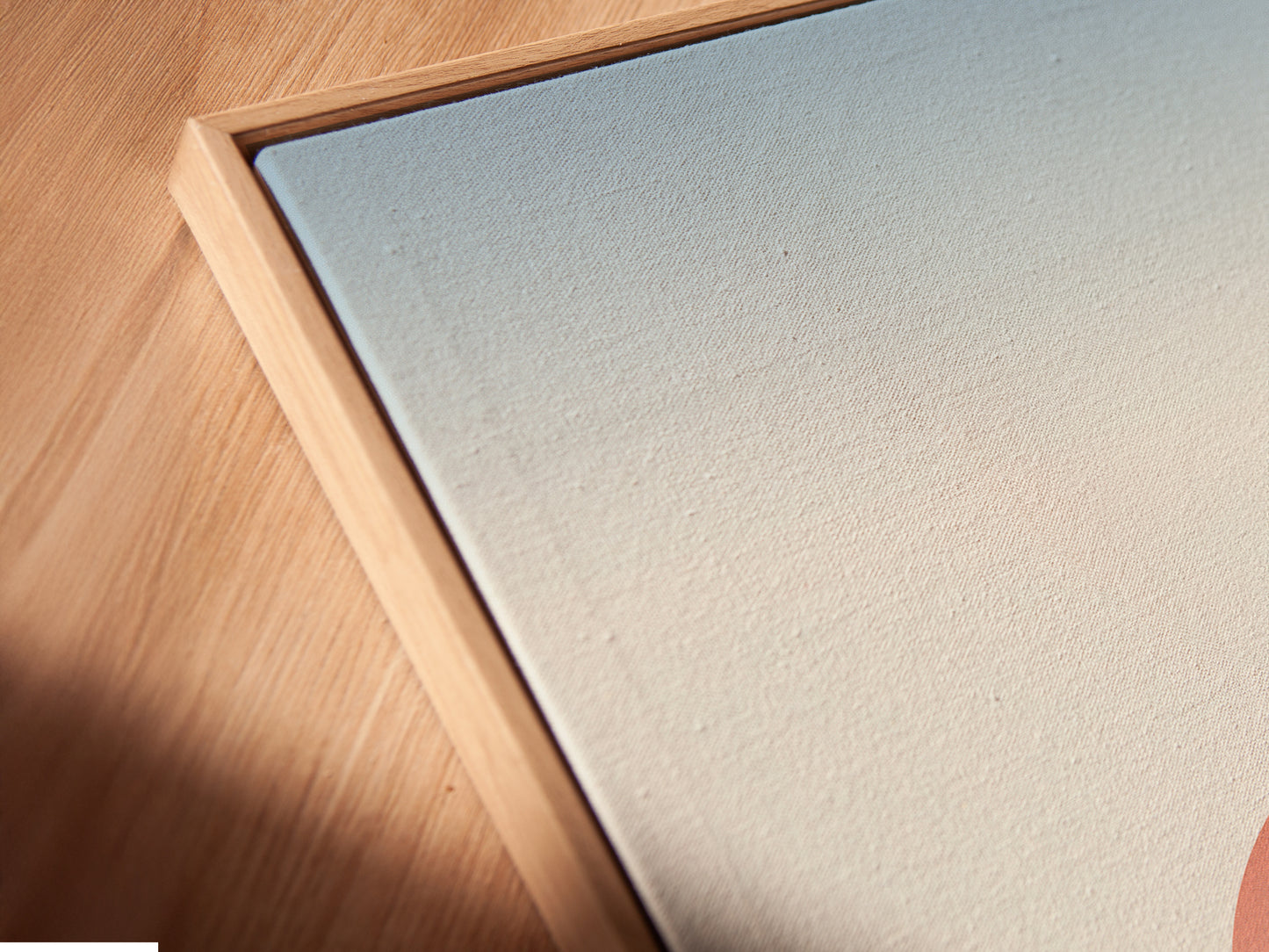 Close-up of a canvas print in a floating frame. The Sunrise Mountain artwork is displayed. The floating frame gives a modern gallery look. The minimalist landscape enhances the serene pathway.