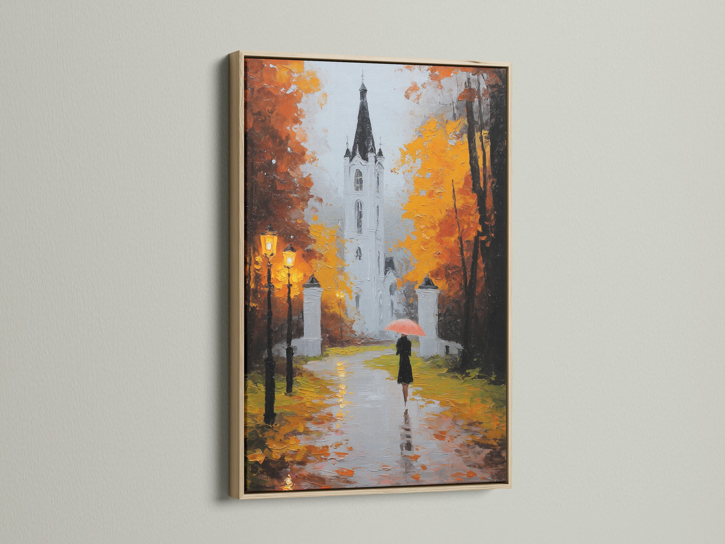 Artwork in an oak frame hanging on a wall. The art depicts a building a person with an umbrella. The oak frame adds a touch of nature. Transform your home with framed art.