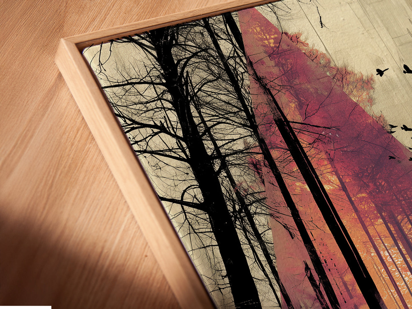 A close-up angled view reveals a canvas print in a floating frame. The floating frame gives the artwork a unique three-dimensional effect. The moody landscape artwork enhances any space. Perfect for art studios or cafes.