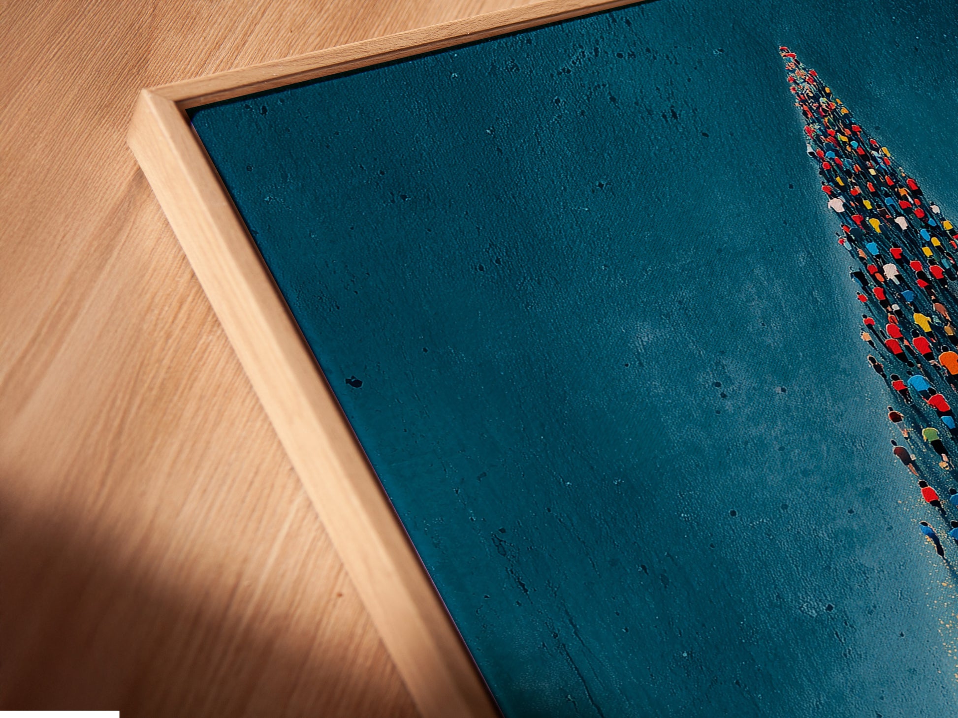 A close-up angled view of the aerial swimmers canvas print in a floating frame. The floating frame gives the artwork a modern and sophisticated look. The print highlights the unique swimming formation. The artwork is ideal for home office decor or sports clinics. It adds an inspiring touch to any space.