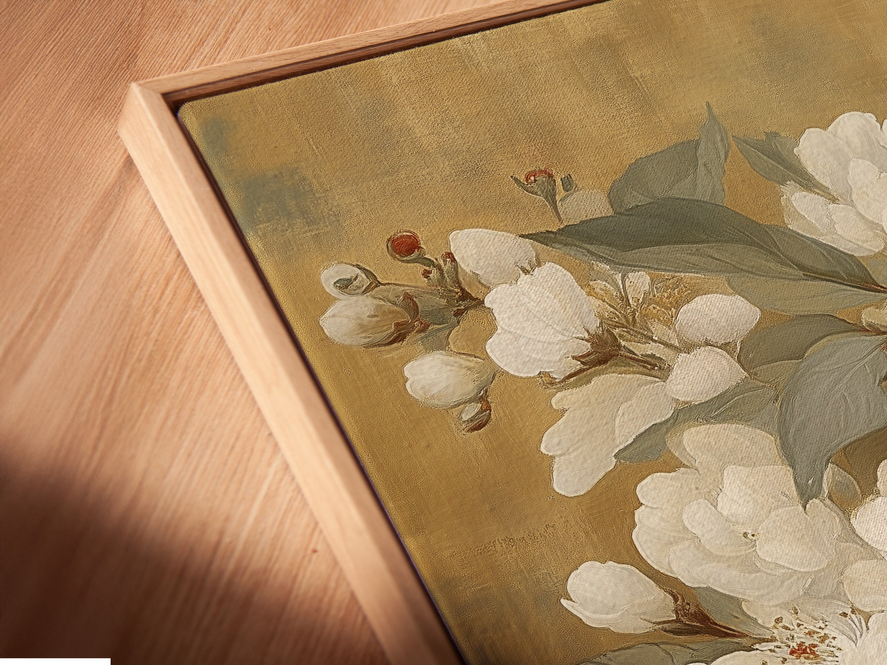 A close-up angled view of a canvas print in a floating frame. The artwork features a vintage botanical print with white flowers and a butterfly. This floating frame enhances the artwork's depth. Perfect for adding a touch of elegance to your living room or office.