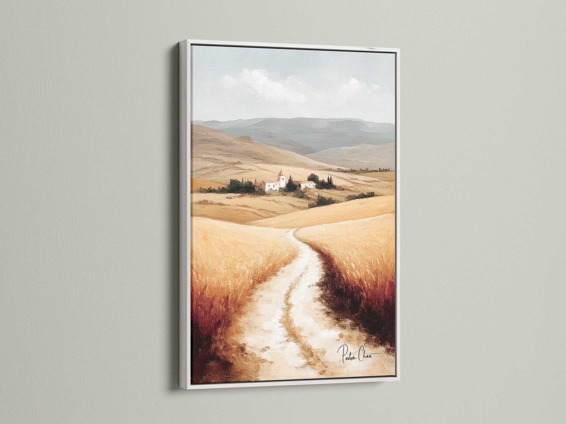 Tuscan Landscape artwork with a white frame. This countryside wall art complements any farmhouse decor. The neutral tone art highlights the Italian scenery. Featuring wheat field art this piece brings a touch of Europe to your walls. Perfect for creating a rustic ambiance.