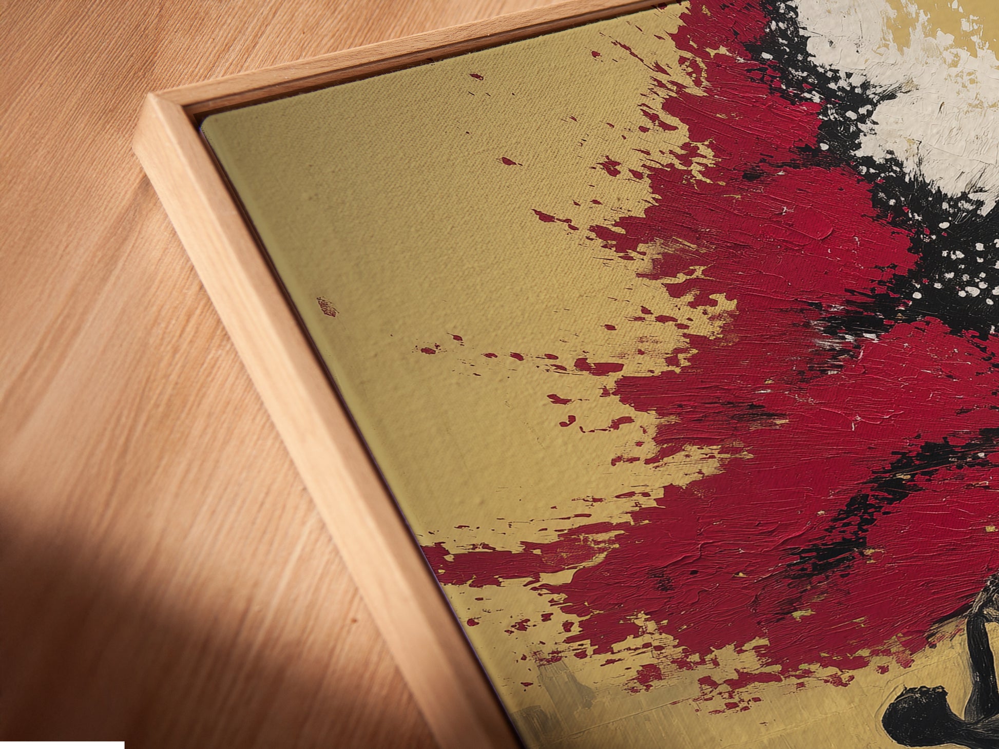 Close-up of a canvas print in a floating frame. This modern ballet dancers artwork adds depth to your wall decor. The floating frame enhances the art. The red and white colors create a striking visual impact. Perfect for contemporary spaces.