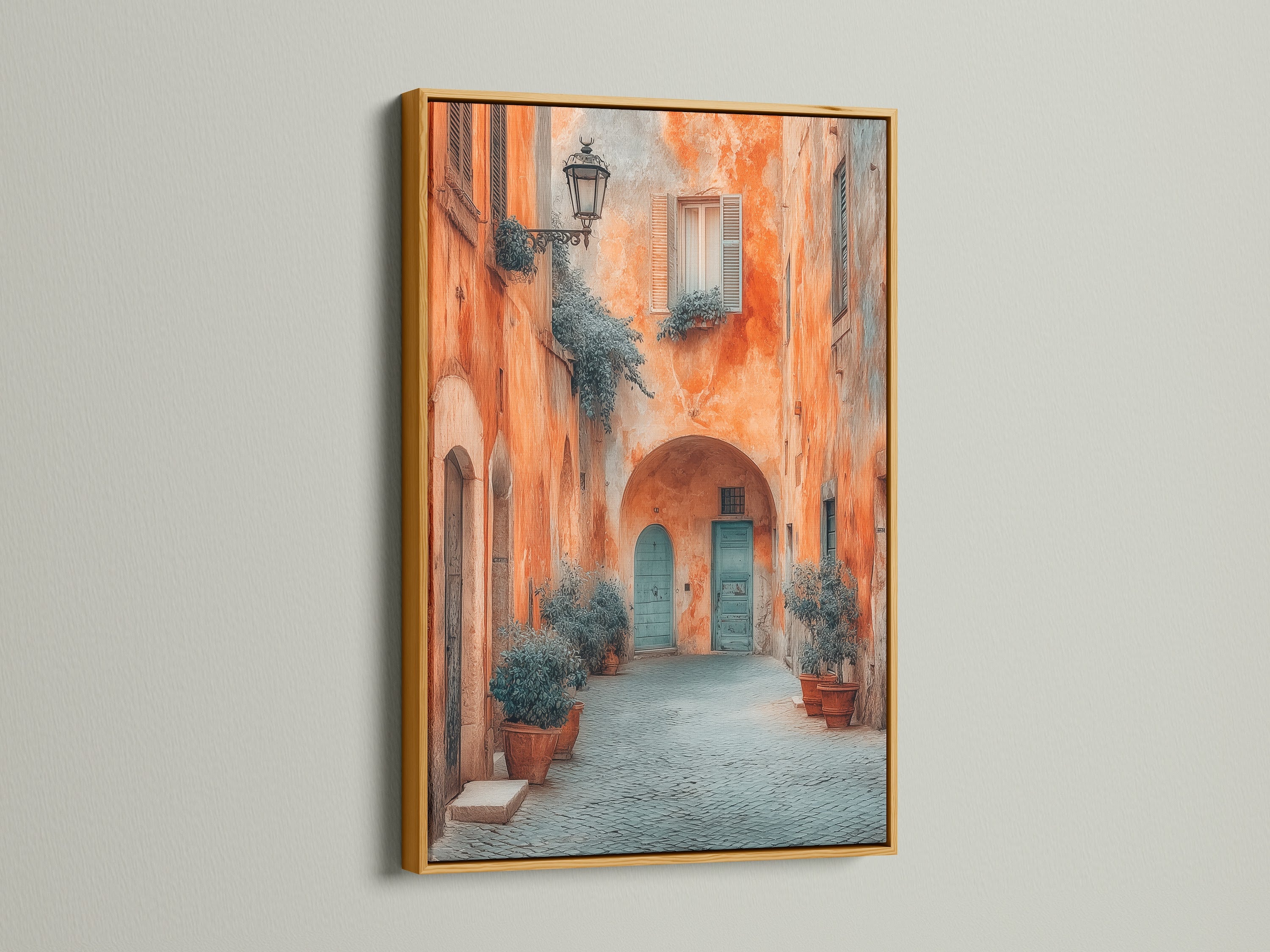 The Italian Alley artwork is displayed in a gold frame. This Tuscan architecture wall art features terracotta buildings and a blue door. This European travel photography is perfect for office decor. This fine art print would look great in any space