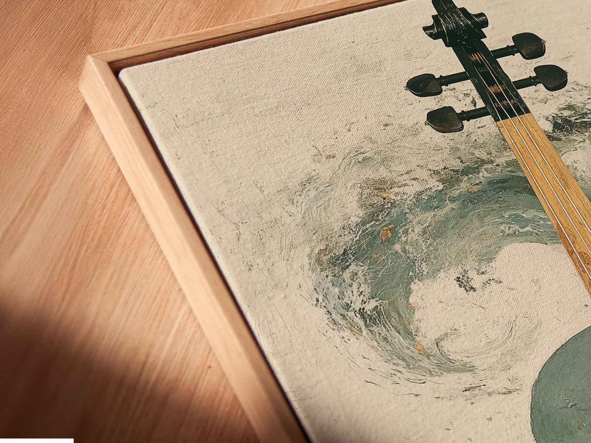Close-up of an Abstract Violin Canvas Print in a floating frame. The floating frame gives the artwork a modern and gallery-like appearance. This teal and gold musical artwork adds depth and dimension to any wall. Perfect for homeowners and interior decorators.
