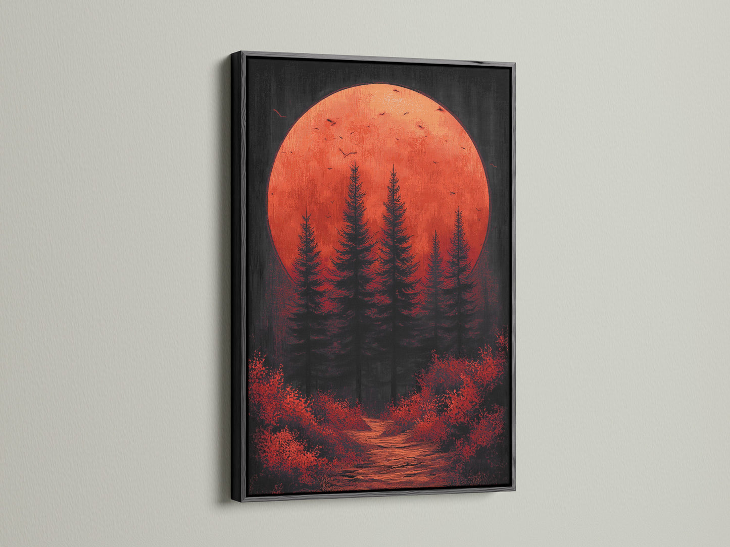 The forest moon artwork is presented in a sleek black frame. This dark nature art piece features a red sunset print. It adds a touch of sophistication to any space. Perfect as living room wall art or office wall art this print offers a contemporary style.