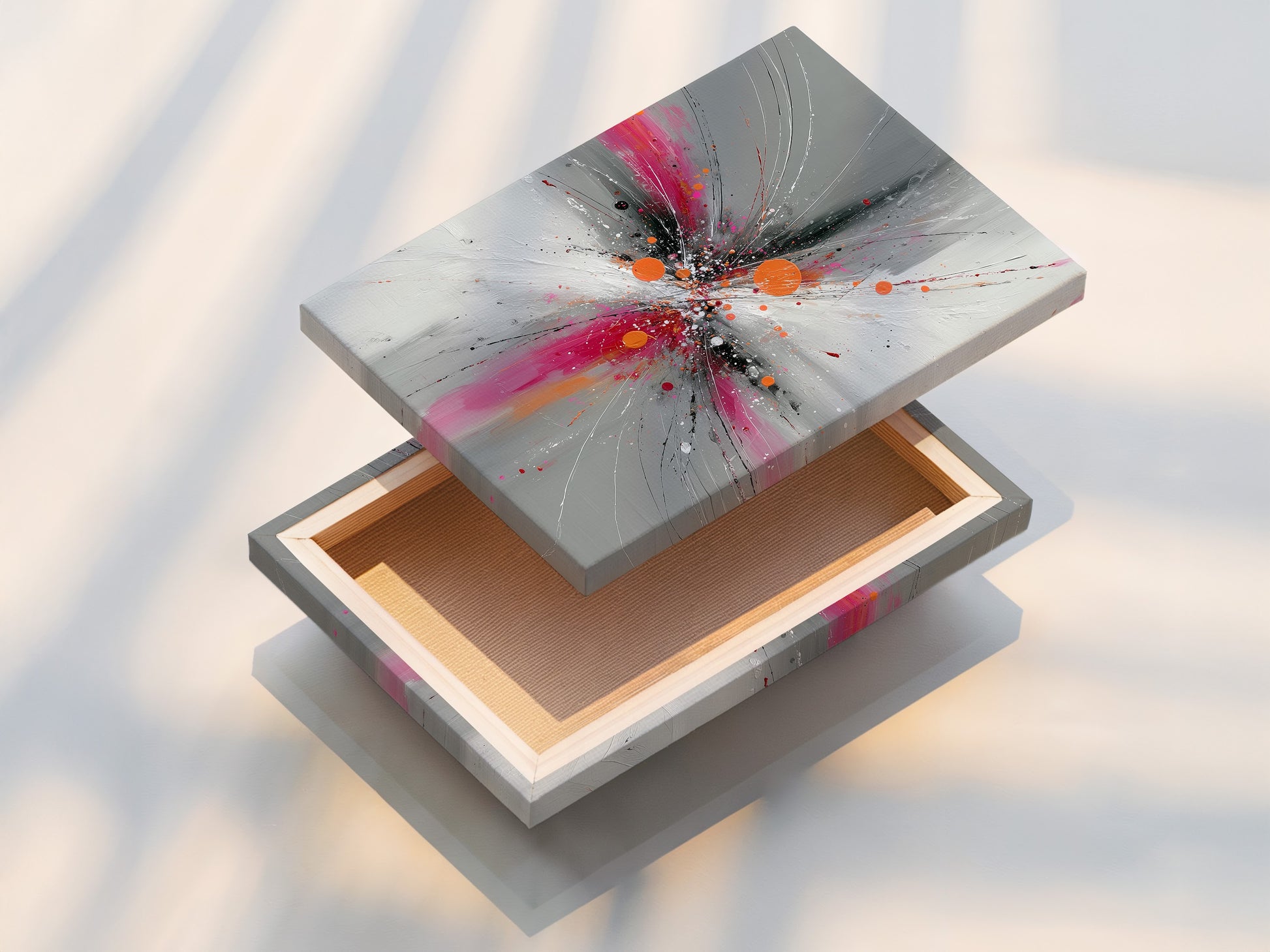 Stretched canvas print of Abstract Burst artwork featuring pink gray and orange tones. This contemporary explosion print is ready to hang. Perfect for adding a modern touch to your living room or office. The stretched canvas provides a gallery ready look. Enjoy this vibrant art in your space.