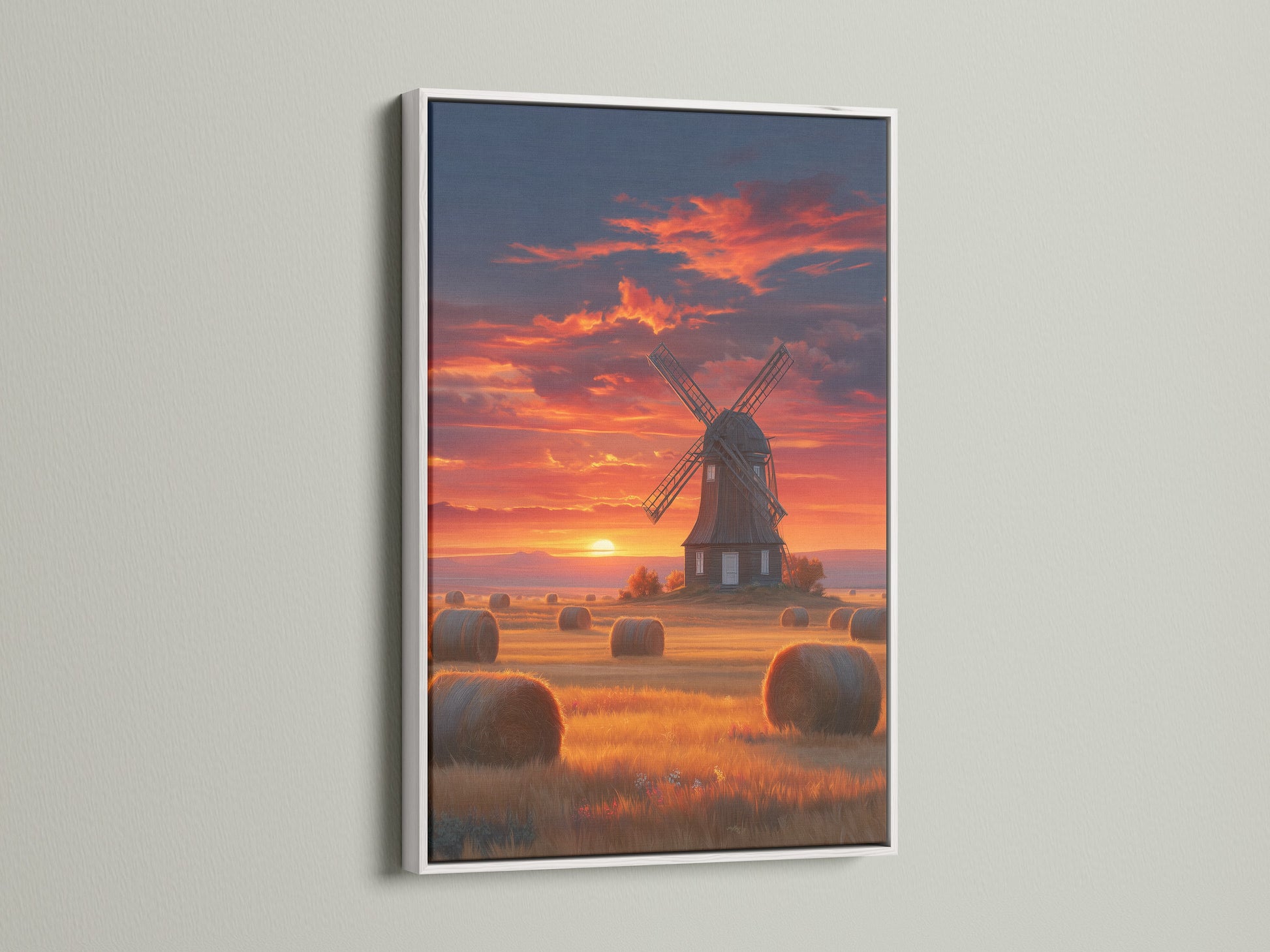 The windmill sunset artwork is showcased in a white frame. This fine art piece brings a serene Dutch countryside view to your home. It enhances any farmhouse style decor.