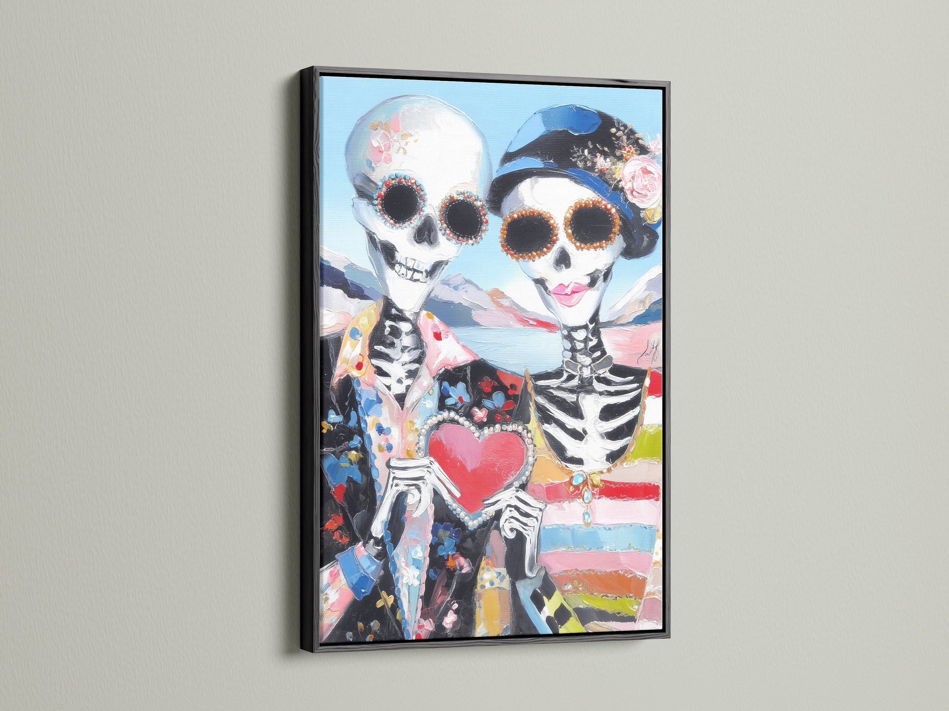 Calavera print featuring a sugar skull couple in a black frame. This muertos canvas is perfect for Halloween decor. The folk art print adds a gothic touch to any room. It is excellent as Dia de Muertos art.