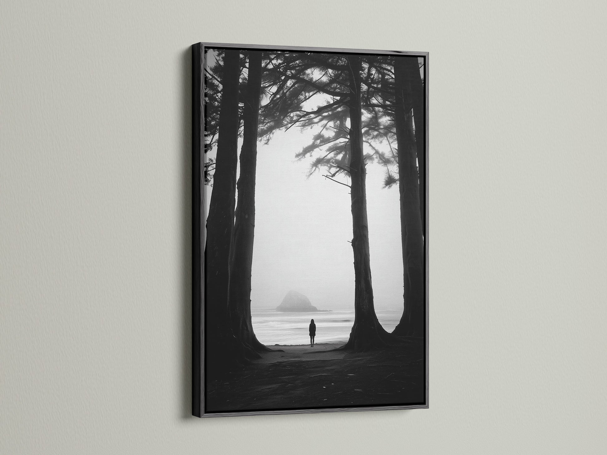 Black and white art print of a beach and forest. The artwork is presented in a sleek black frame. A black frame adds sophistication to any art piece. It creates a striking contrast with the wall. Consider a black frame for your next art purchase.