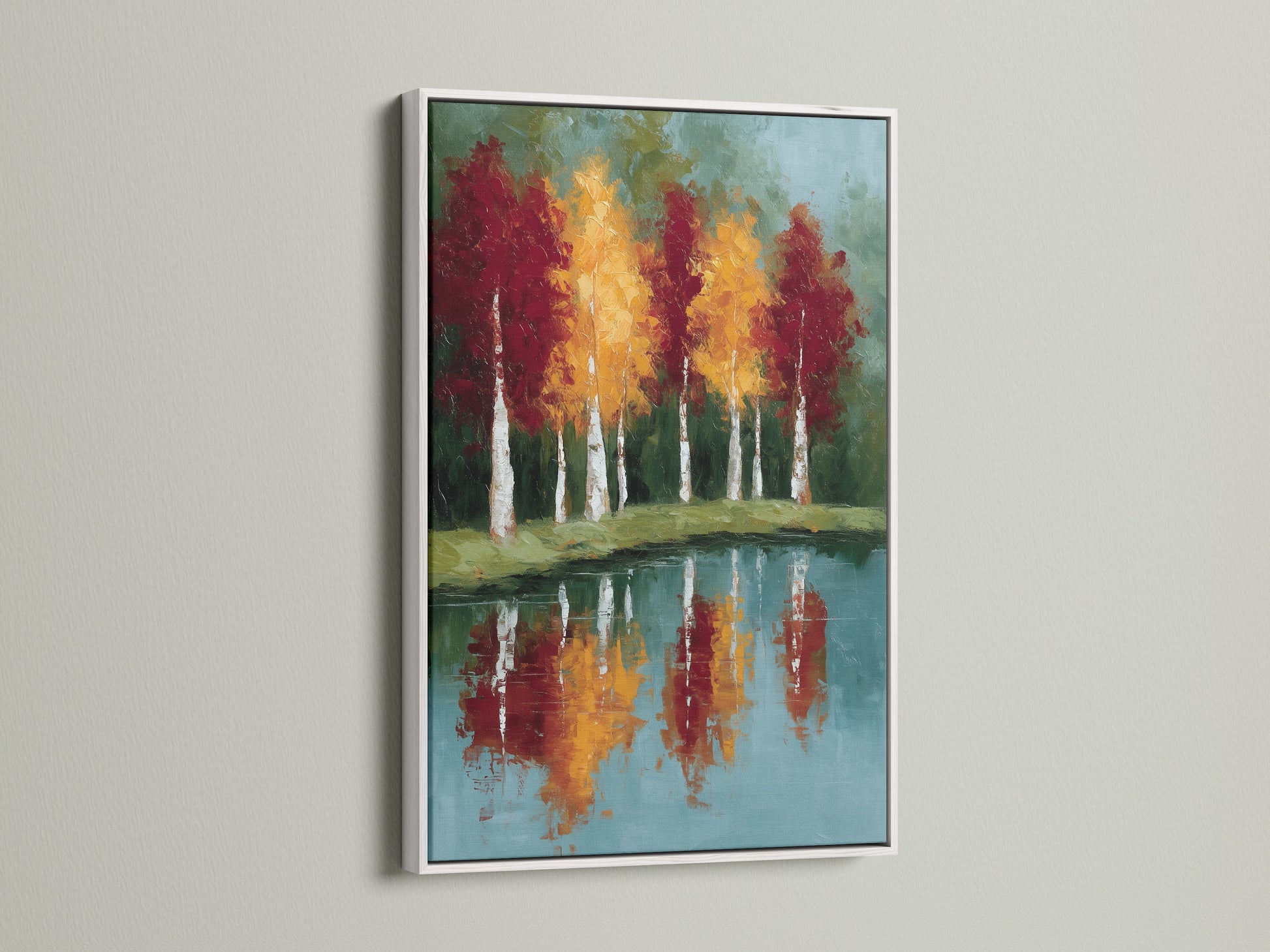 Enhance your space with framed autumn trees artwork with a white frame. The reflected landscape wall art includes a teal blue lake painting. A white frame offers a clean modern aesthetic to complement your modern wall art.