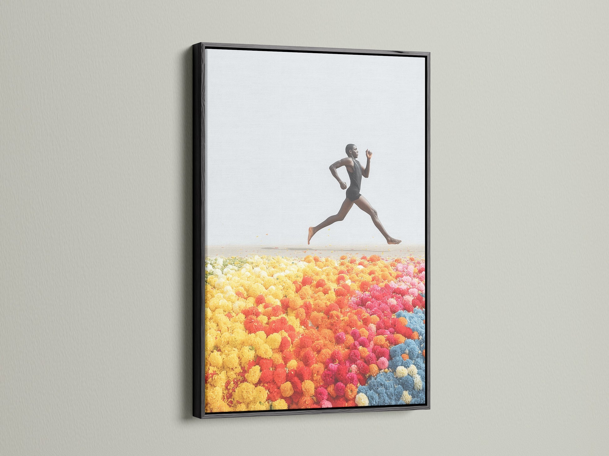Runner Canvas Print is elegantly framed in black. The artwork depicts an energetic pose. This piece makes a bold statement as athlete wall art. Discover our range of modern art and colorful prints today.