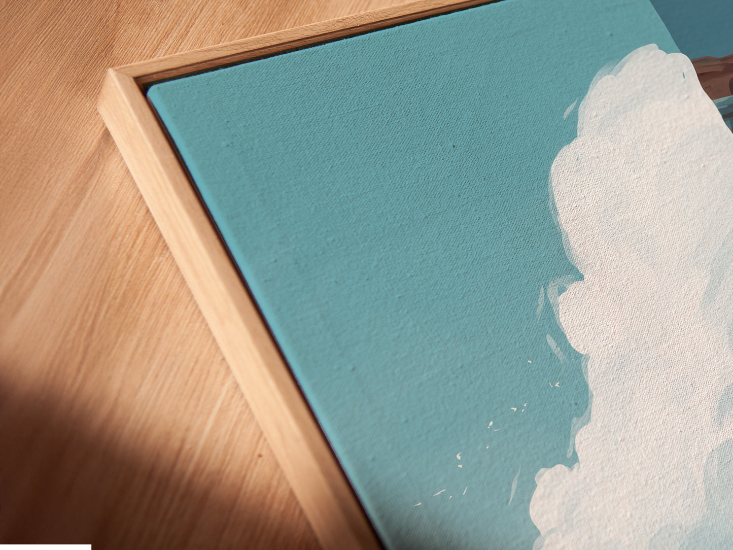 A close-up of a Coastal Lighthouse canvas print in a floating frame. The angled view highlights the texture and detail of the artwork. This piece brings a touch of the coast to any room. Perfect wall art.