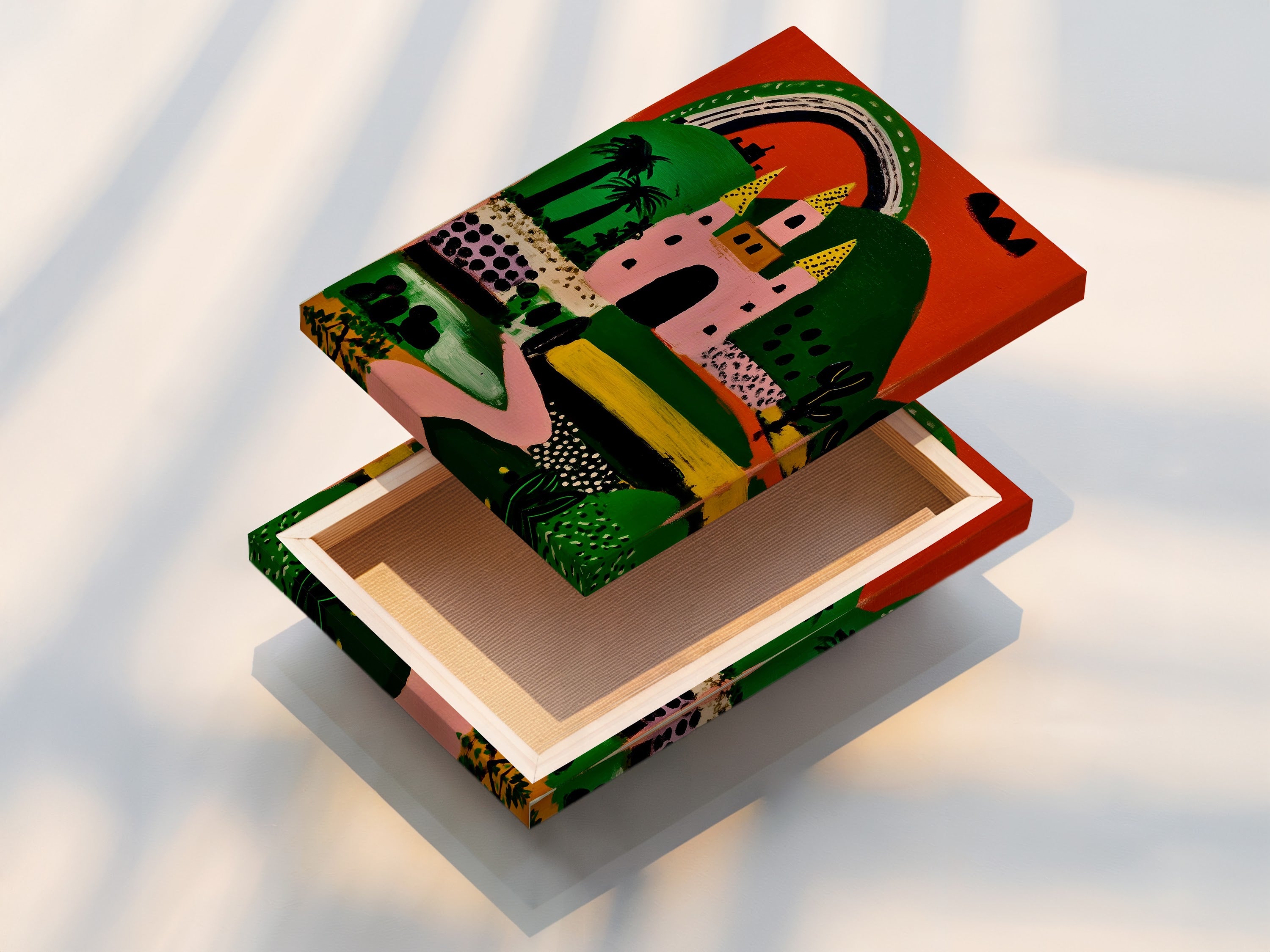 A stretched canvas print showcases a colorful fantasy castle artwork. The vibrant print includes a pink castle green hills and rainbow. Ready to hang this playful art is perfect for adding a whimsical touch to any room.