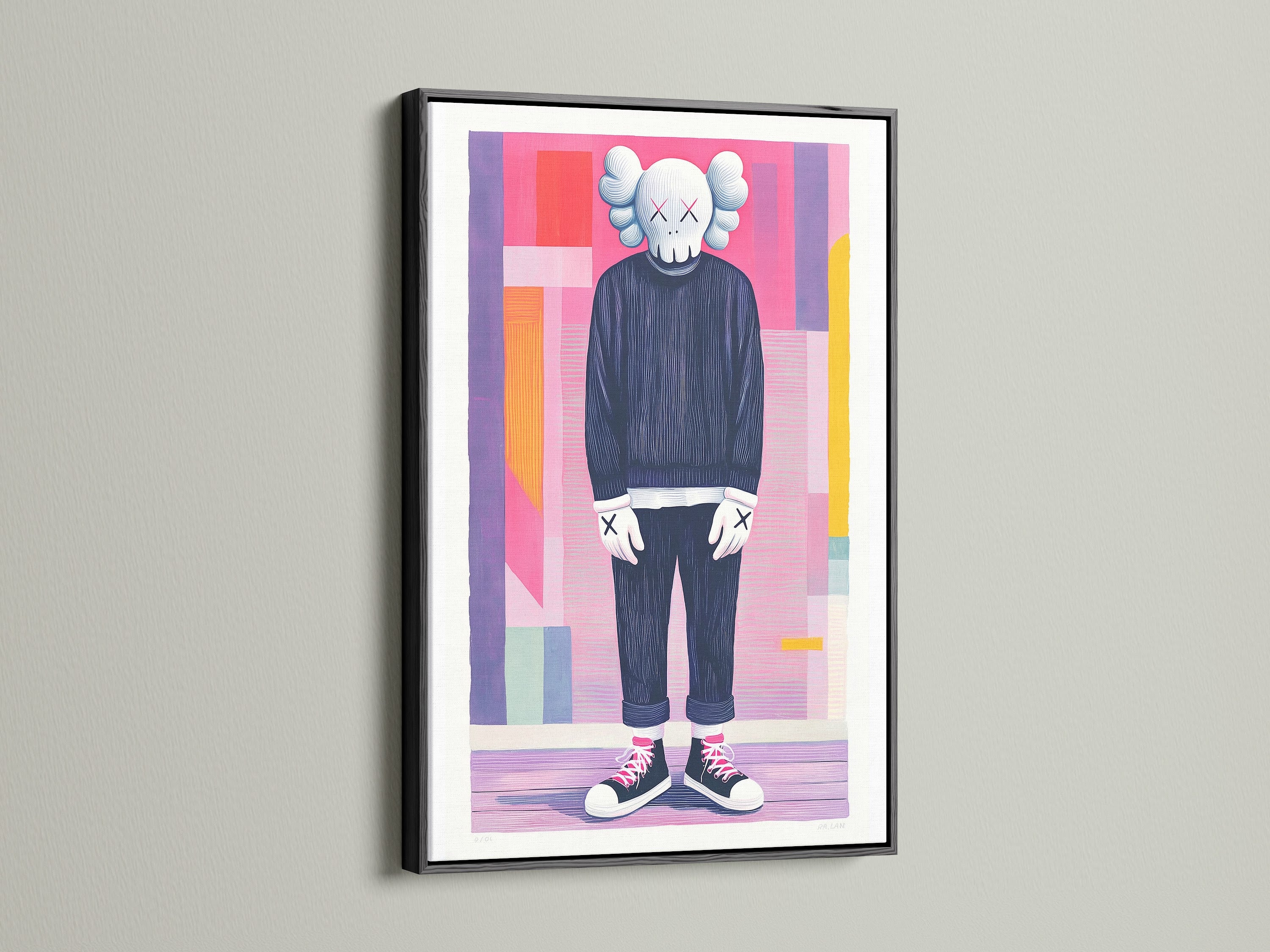 The artwork features a human-like figure with a skull head. It is framed in sleek black. The artwork is mounted on a white wall. The black frame adds a bold statement. It is a striking contrast to the colorful artwork. Perfect for a modern aesthetic.