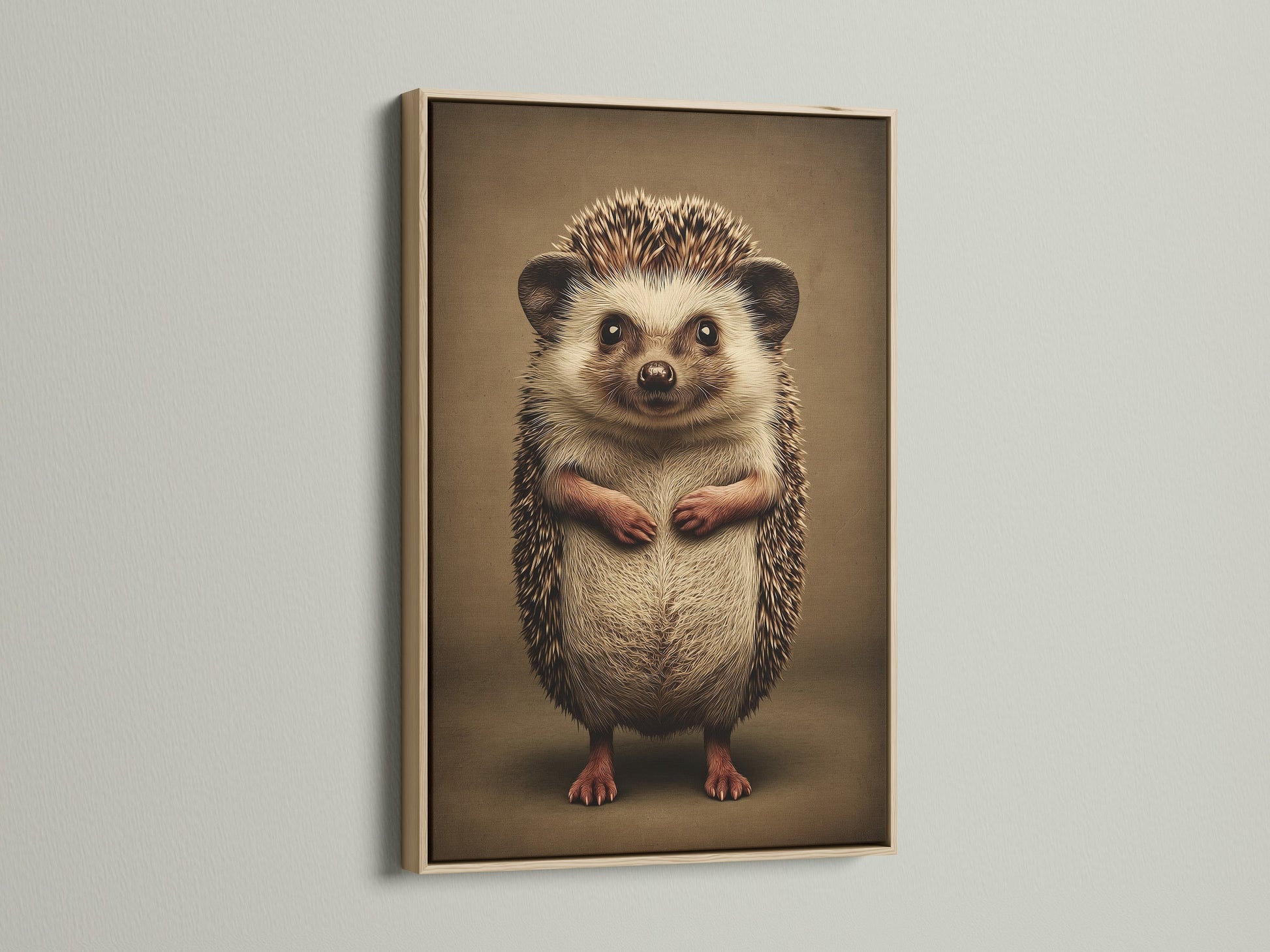 A close up of a hedgehog art print in an oak frame. This woodland animal art is ideal for a nursery. It's a cute animal print to add to your kids room. The neutral color will complement any room.