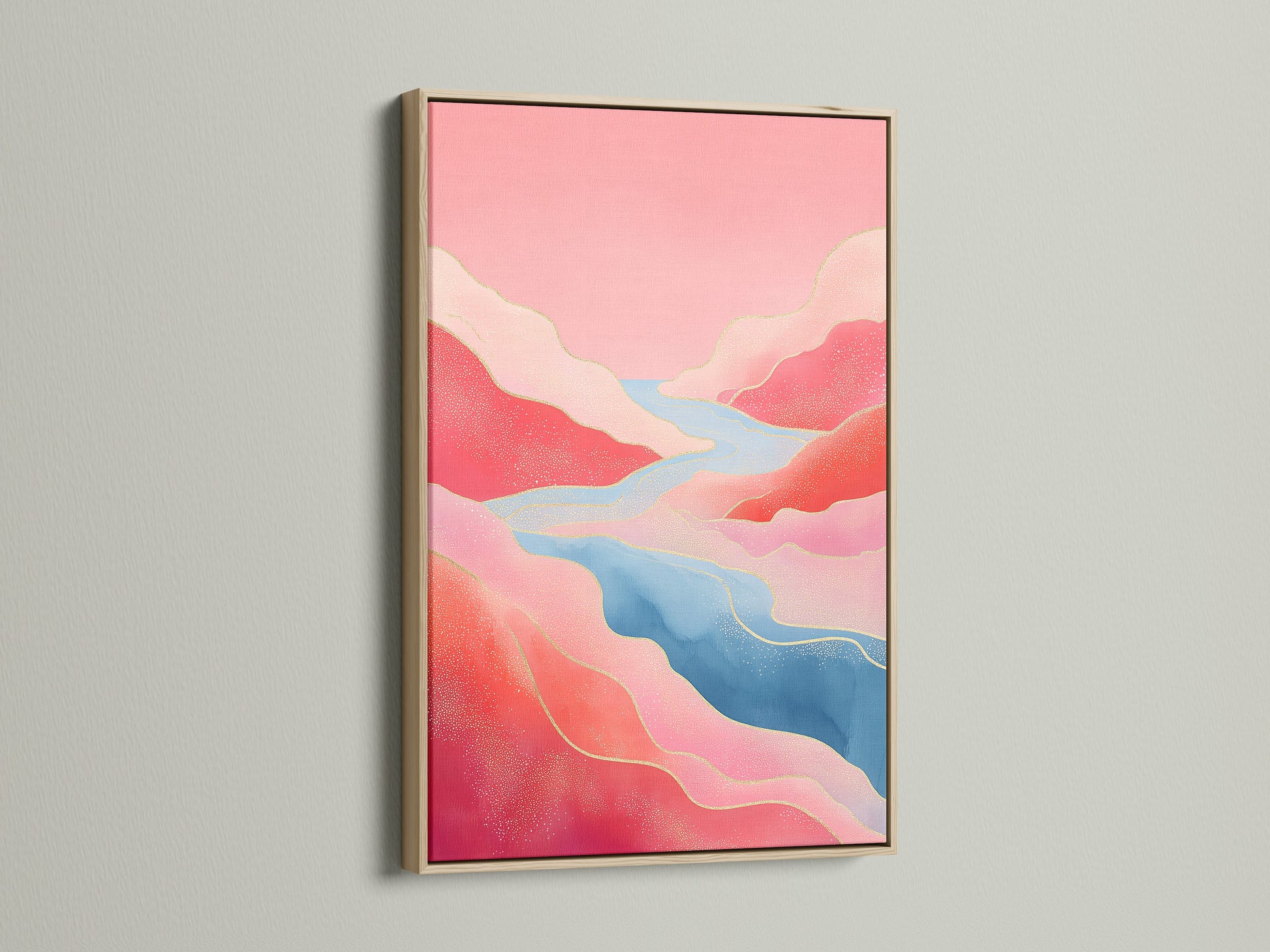 An abstract river canvas art print displayed in an oak frame. The pink mountain art and flowing river create a serene modern nature print. Perfect for adding a bohemian style to your living room.