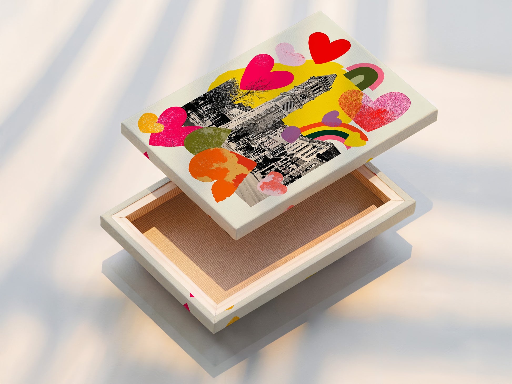 A stretched canvas print ready to hang. The art features a clock tower.  It also has colorful hearts and rainbows. The stretched canvas offers a gallery-wrapped look.  It enhances the visual impact of the artwork.  Transform your space with our high-quality canvas prints today.