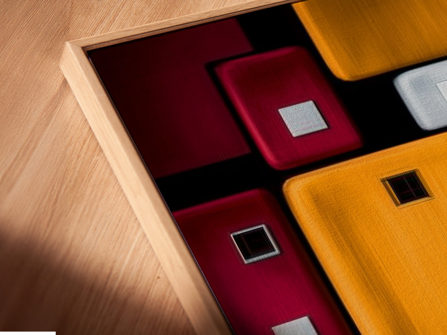 A close-up view shows a canvas print in a floating frame. This geometric abstraction artwork adds depth to your walls. The modern square design creates a contemporary look. Perfect for any home or office space needing wall art.