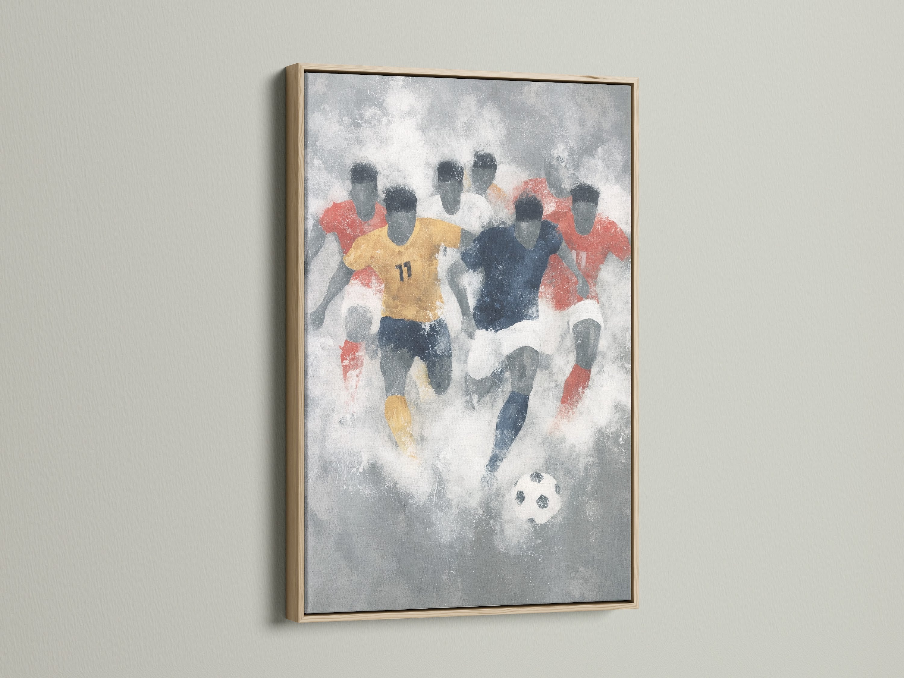 A soccer abstract art print in an oak frame hangs on a white wall. The artwork captures the energy of a soccer match. It is ideal as football canvas art for a sports-themed room. The oak frame complements the modern style of the artwork.