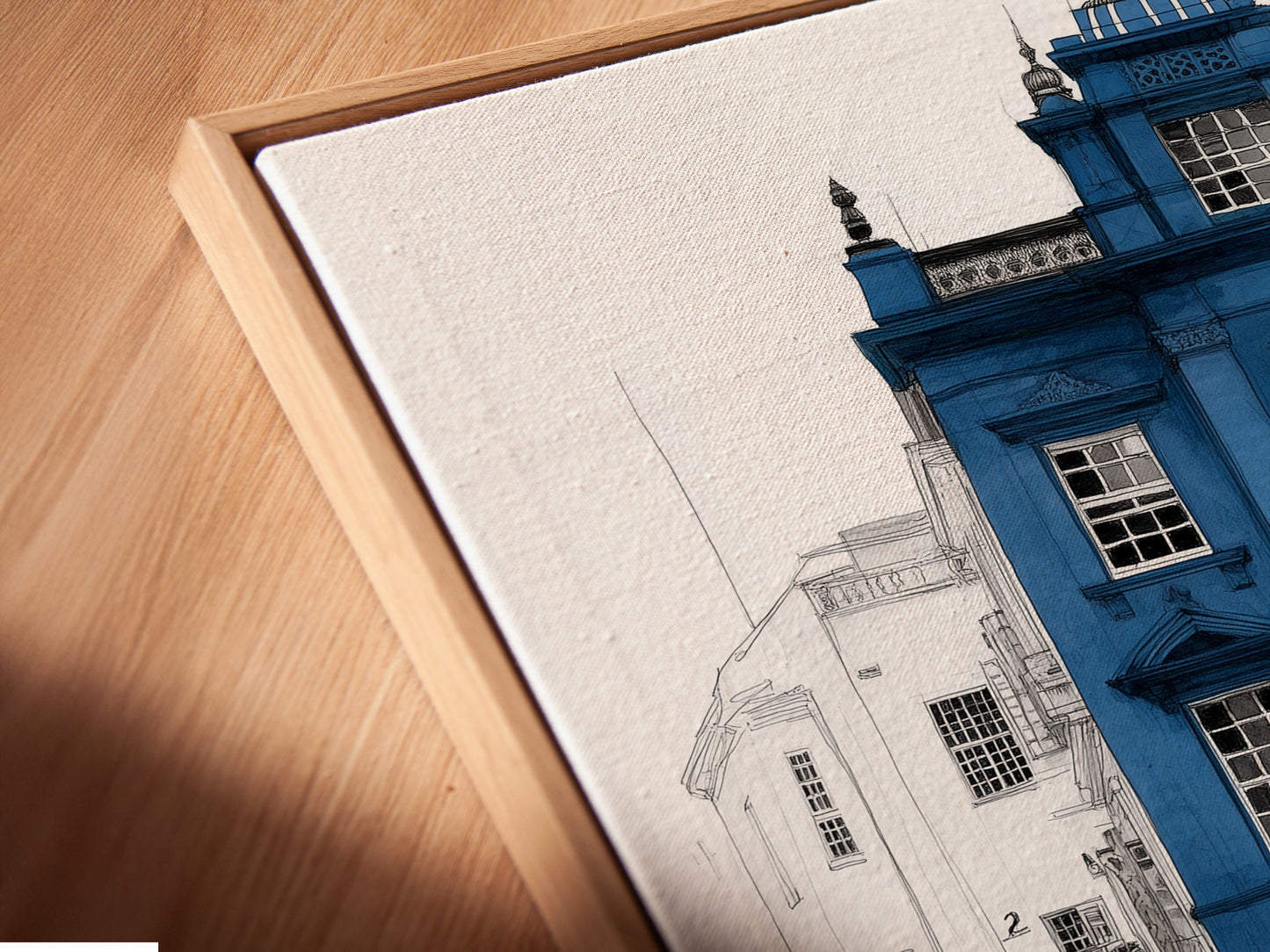 Close-up of a canvas print in a floating frame. The London Architecture Art features a blue building with a yellow door. This modern wall art is perfect for homeowners renters and interior designers. Enhance your space today.