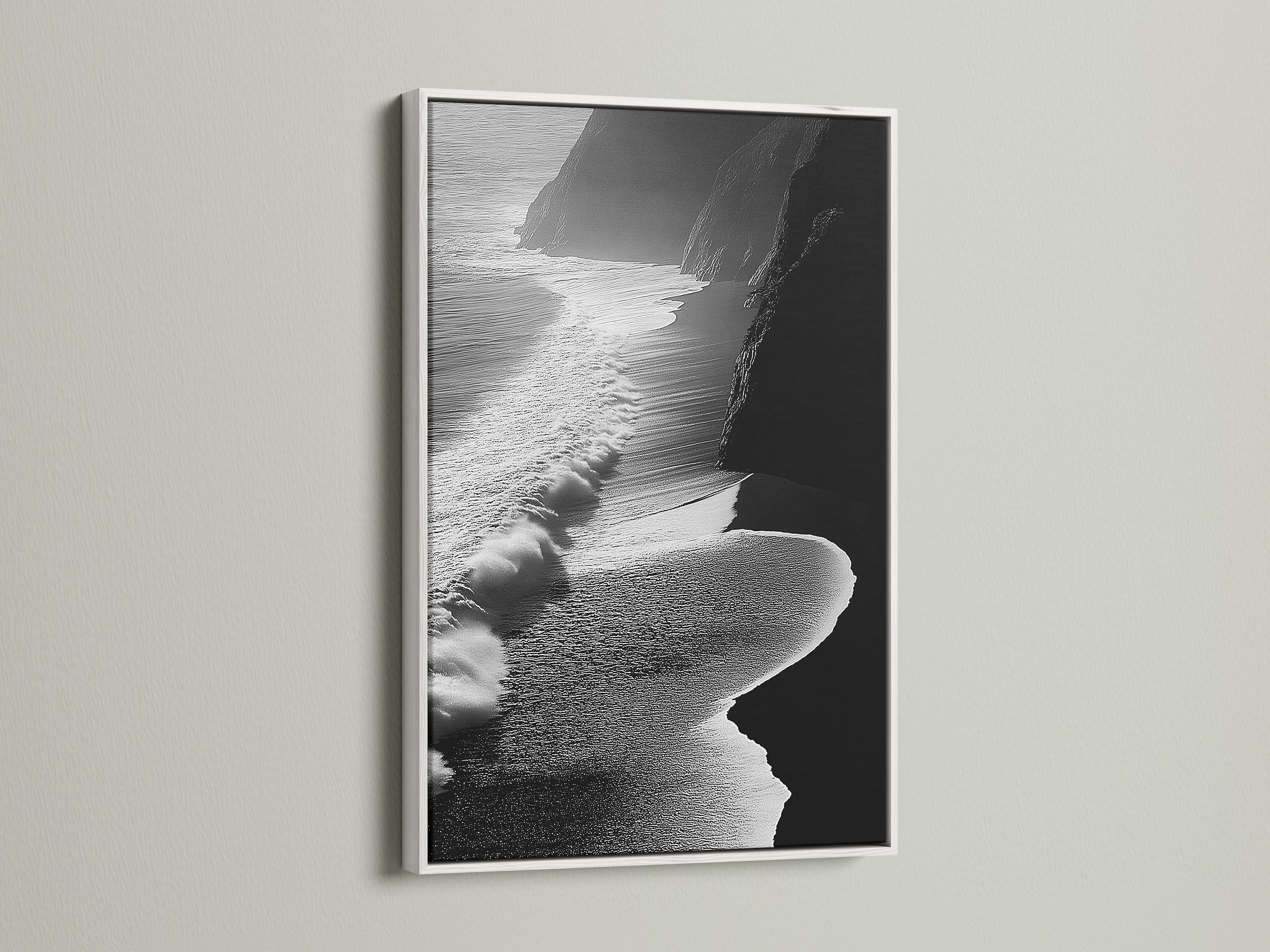 This black and white ocean waves artwork stands out. It has a clean white frame. Ideal for contemporary coastal decor in any room. The aerial beach photography brings a serene touch. The white frame enhances the artwork's minimalist style. Perfect for brightening up living rooms or bedrooms. A stunning piece of ocean artwork to elevate your space.