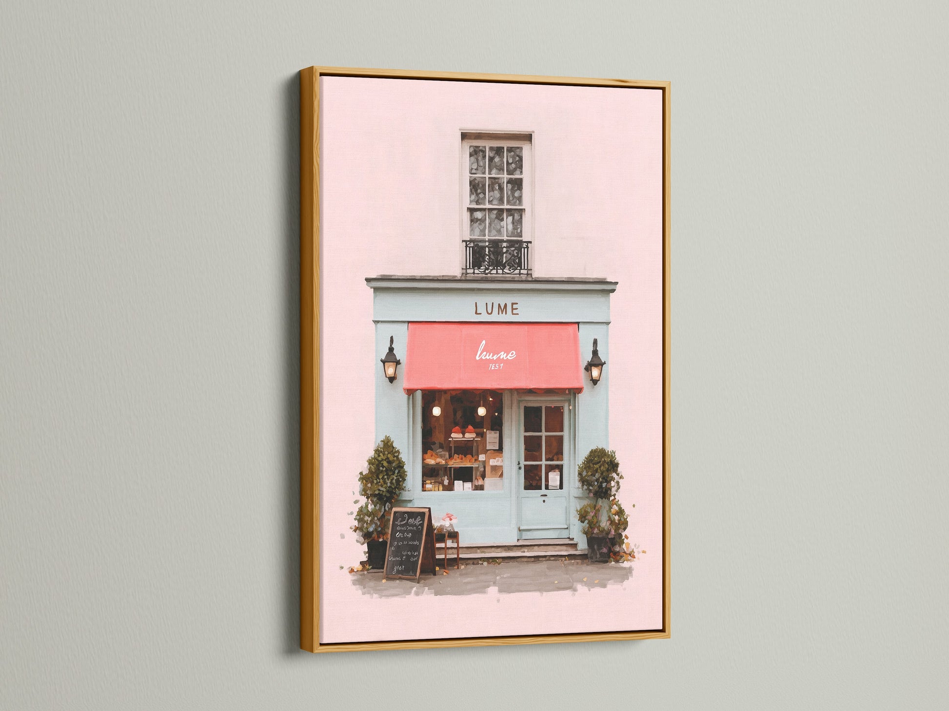This beautiful art print is presented in a luxurious gold frame. The artwork features a charming building with a pink exterior and a vibrant red awning. The gold frame adds a touch of opulence and glamour. The piece enhances the artworkโs beauty. It is Ideal for adding a touch of luxury to your decor.