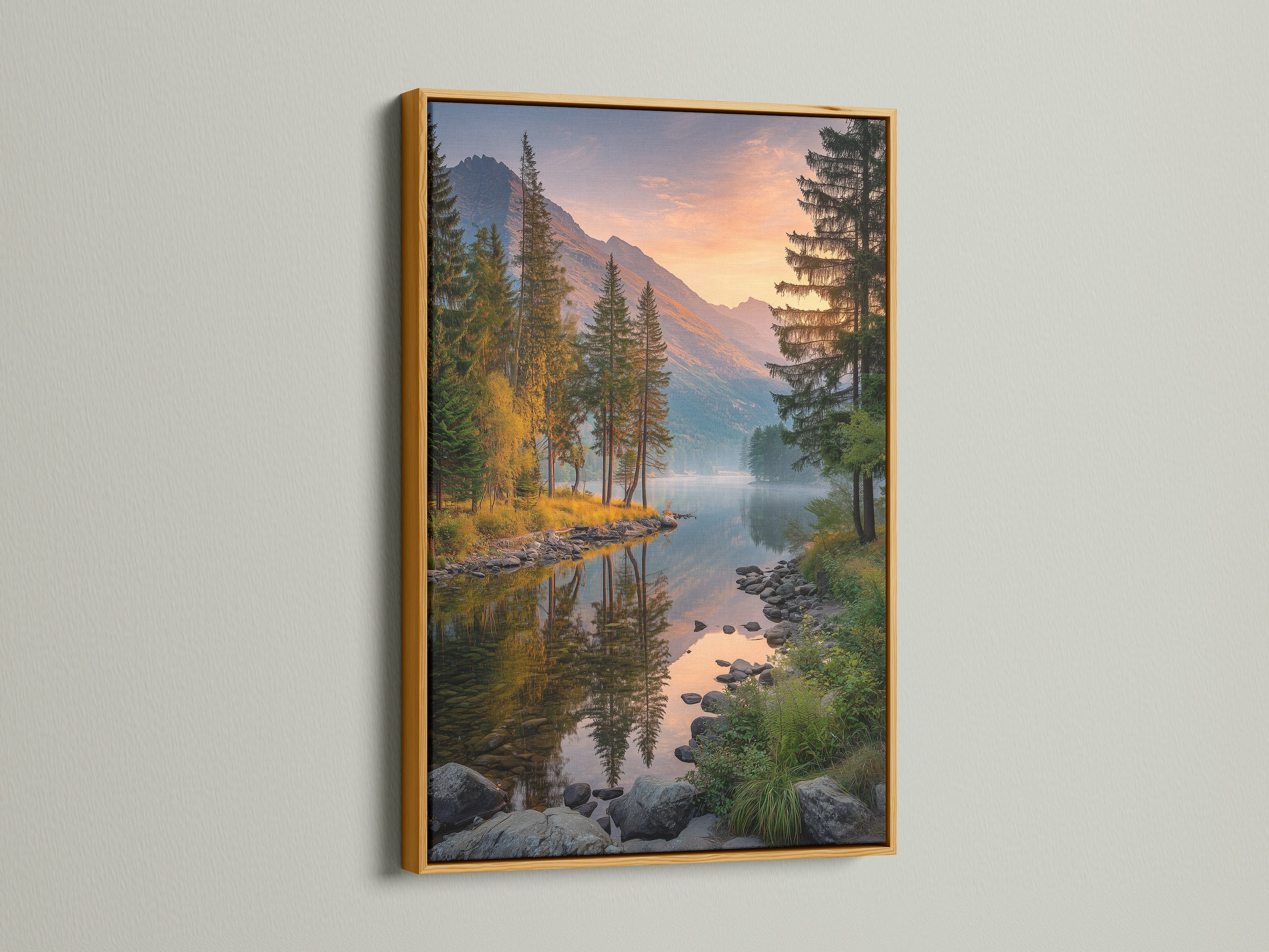 Adorn your walls with a mountain lake canvas print. This artwork is framed in gold and captures a stunning sunset. The nature landscape art piece adds rustic elegance to any interior. Ideal for homeowners looking to bring nature into their home. Create a serene atmosphere with this wilderness art.