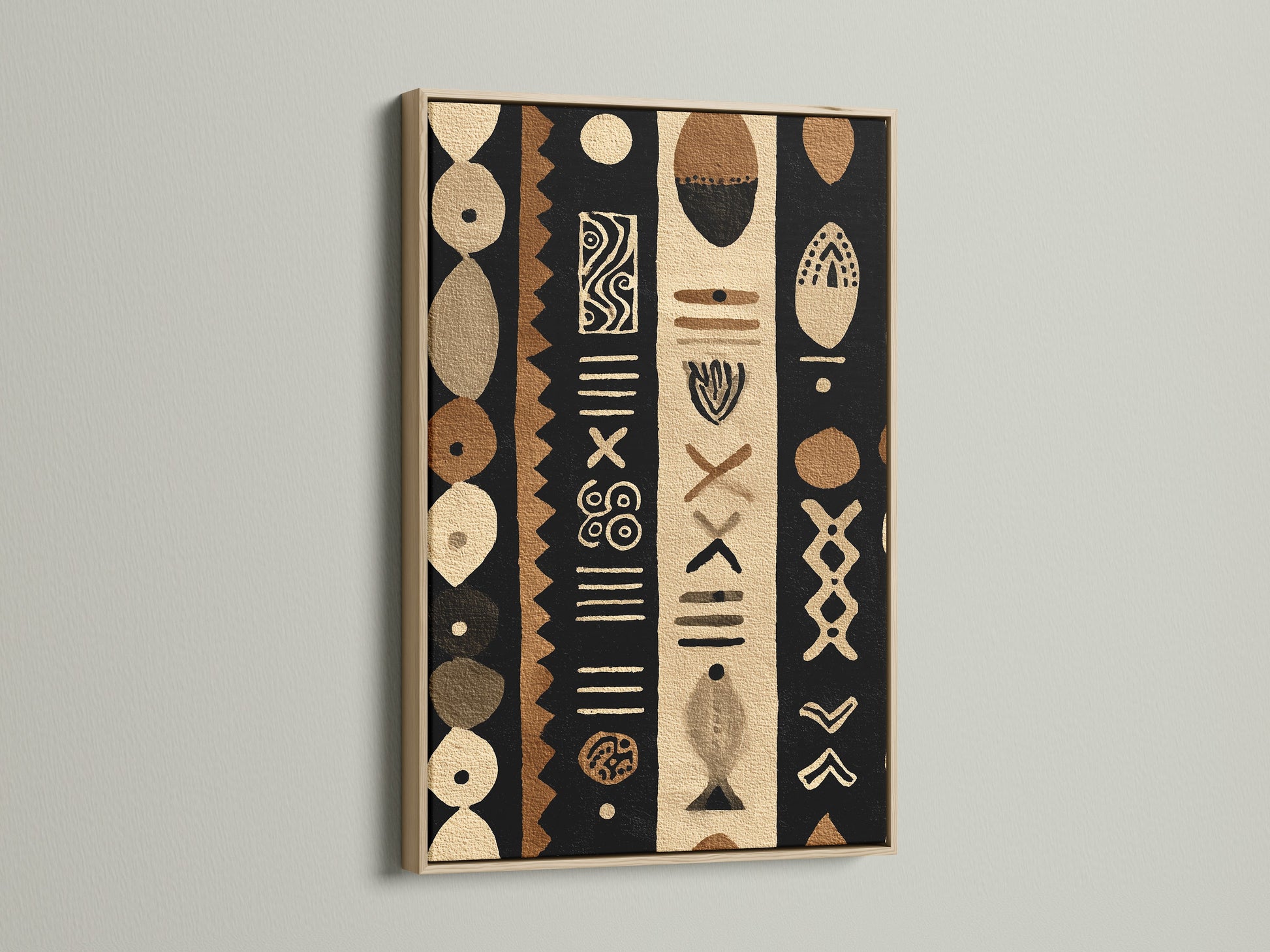A captivating oak frame showcases a tribal artwork. The art features black brown and beige colors. The artwork is displayed against a white wall. The natural wood grain of the oak frame enhances the room's warmth.