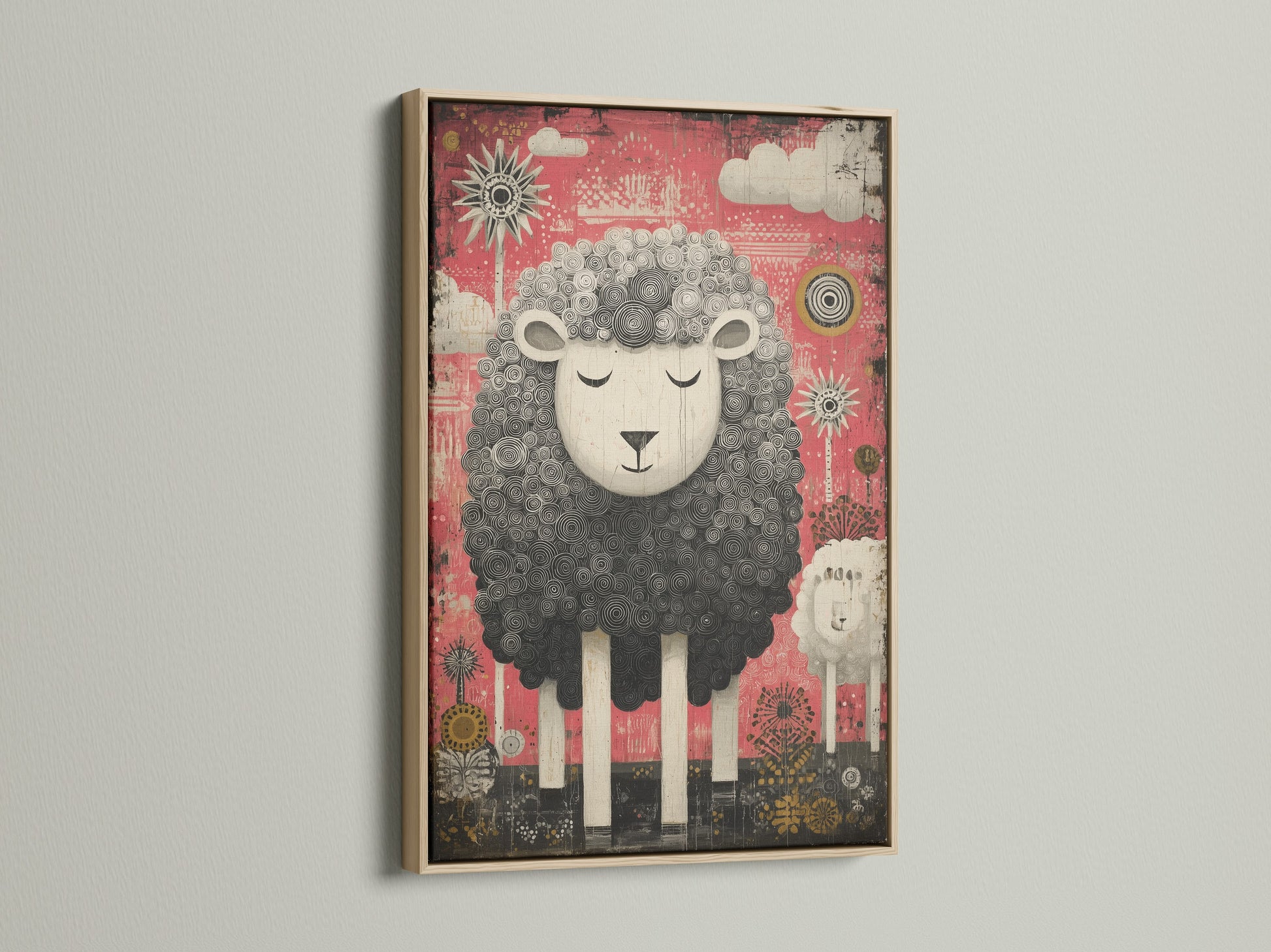 Oak frame showcases a charming sheep artwork. The artwork features a black and white sheep. The sheep is set against a pink backdrop. Clouds and suns decorate the background. The oak frame enhances the artwork's warmth.