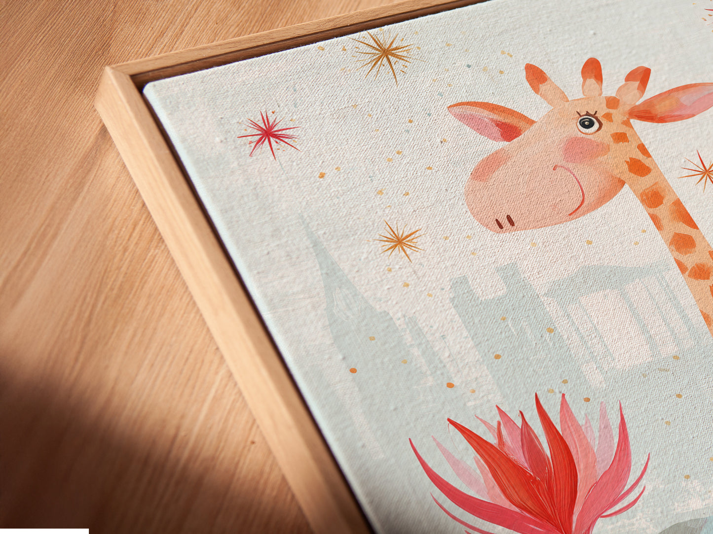 A close up view of a giraffe canvas print in a floating frame. The artwork enhances the nursery decor. Floating frames give a modern gallery feel to kids wall art. Shop now for unique baby room art.