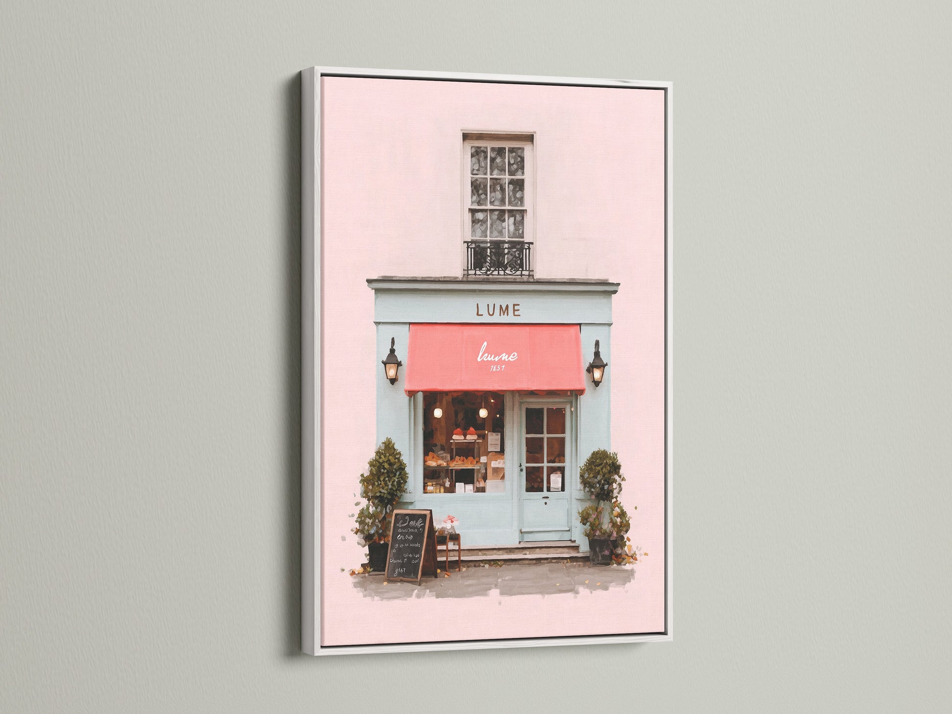This art print is elegantly presented in a white frame. The artwork depicts a lovely building with a pink front and a striking red awning. The white frame offers a clean modern look. It allows the artworkโs colors to truly stand out. This piece is a chic addition to any space.