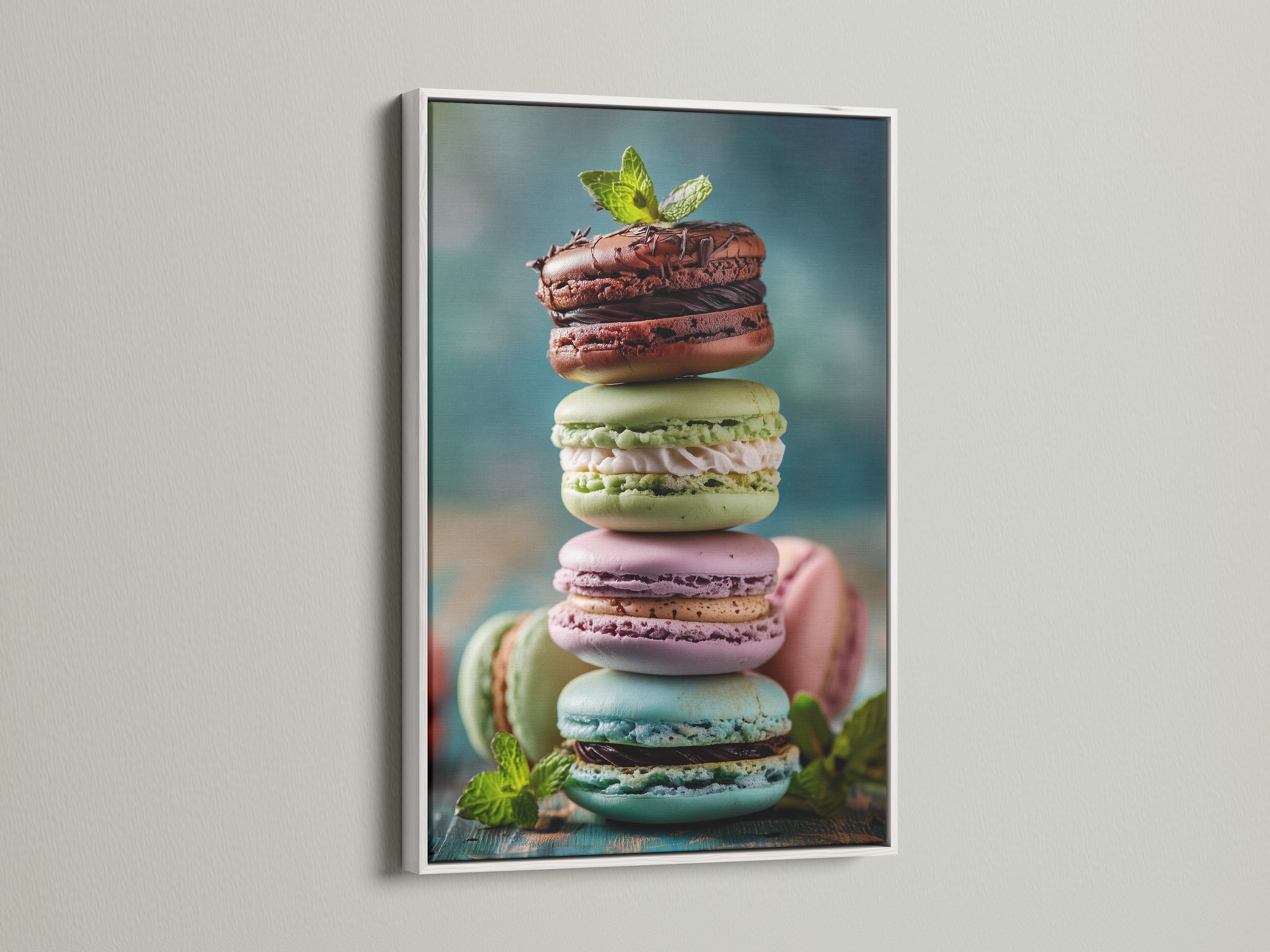 A stack of delicious macarons is beautifully presented in a white frame. The clean white frame enhances the vivid colors of the treats. This artwork brings a fresh modern look to any decor. Explore the crisp look of a white frame.