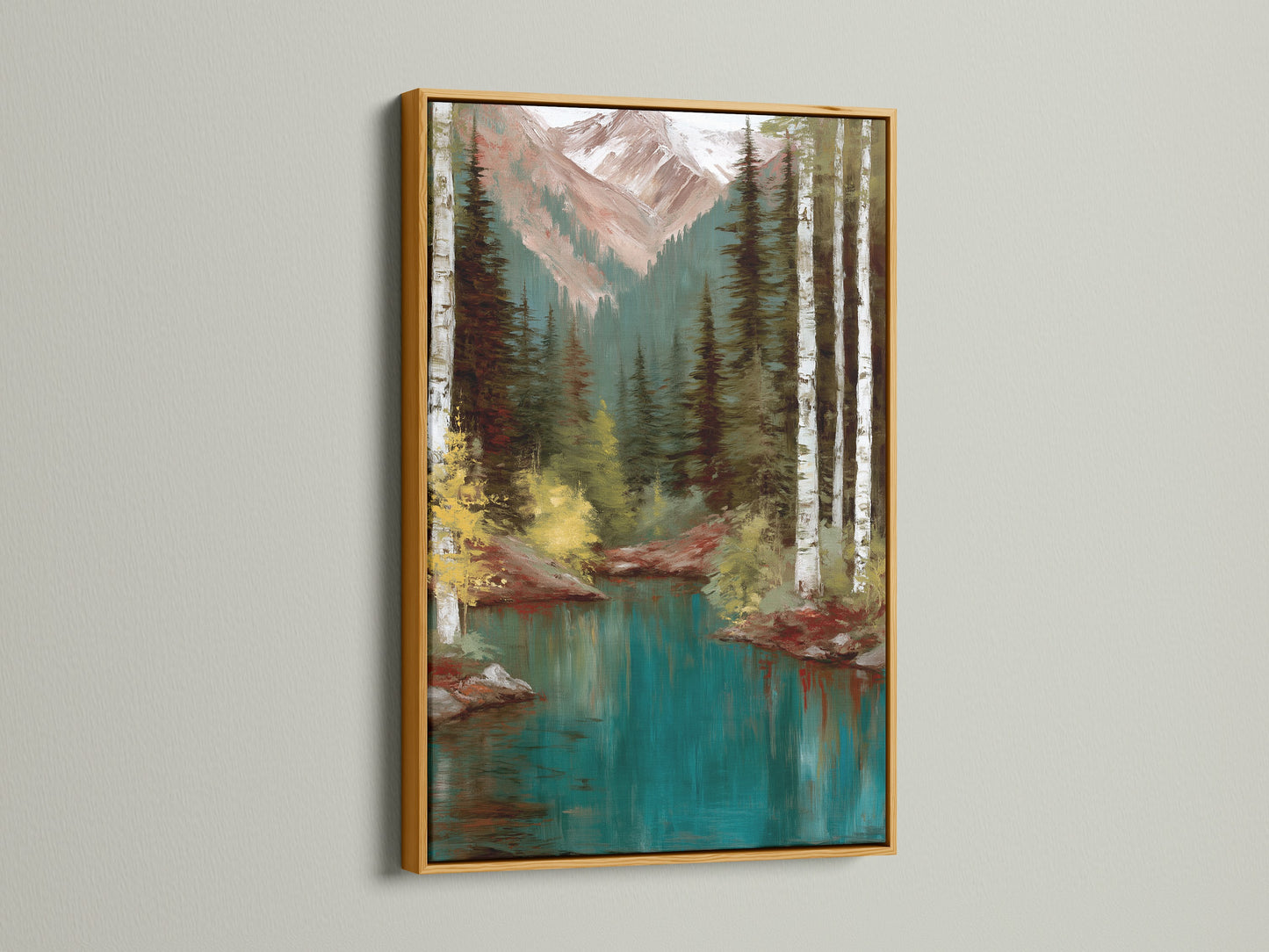 Mountain Lake artwork with a gold frame. The artwork showcases a serene teal lake with birch trees and mountains. The gold frame adds a touch of luxury and sophistication to the nature-inspired art. Ideal for homeowners and cabin owners. Elevate your decor with this exquisite landscape print.
