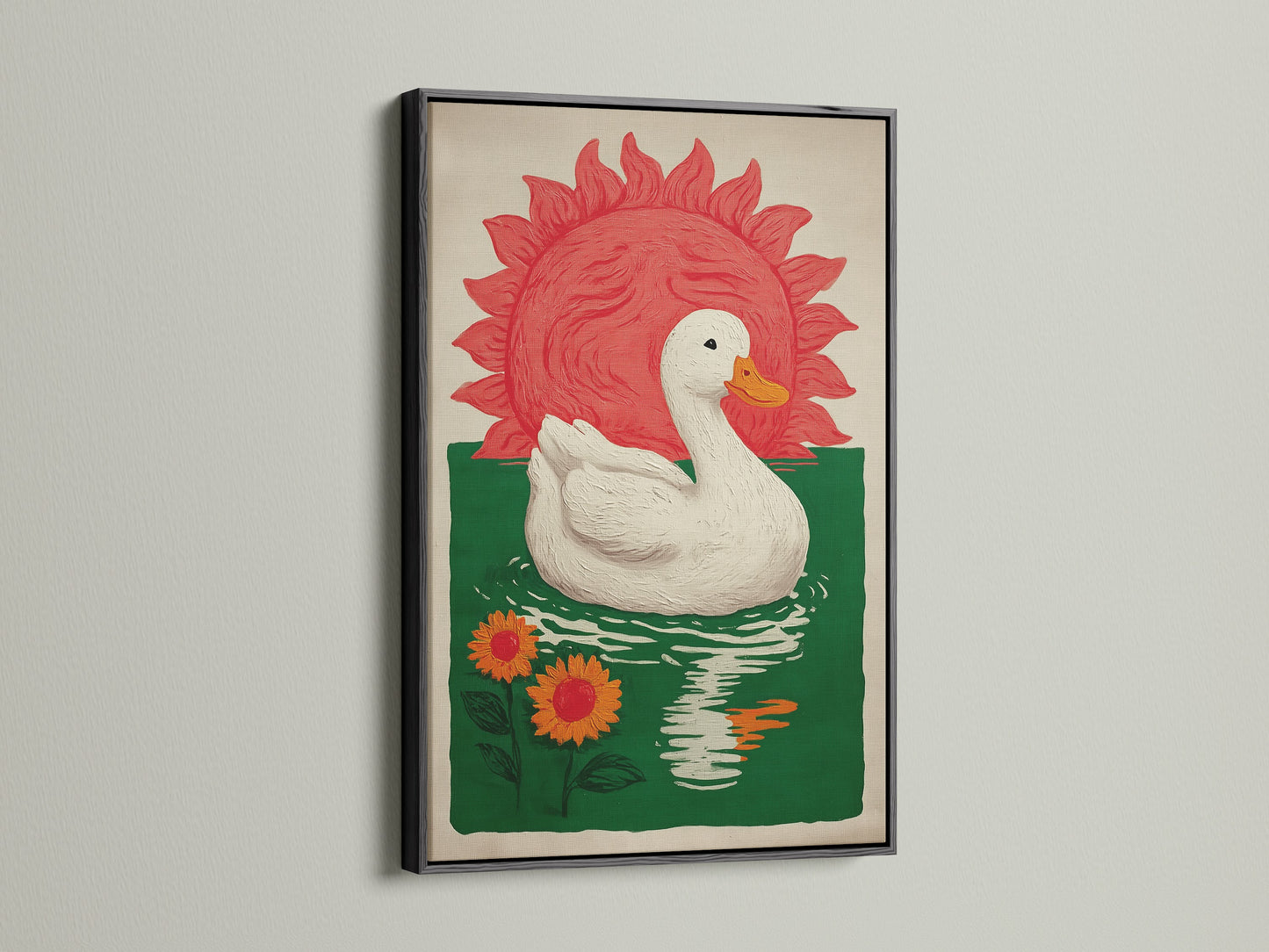 Bohemian Style Wall Art in a black frame. The art features a white duck floating on green water with orange sunflowers. A red sun is in the background. This bohemian decor would be great for a dining area. Consider this pond print for farmhouse rustic or eclectic styles.