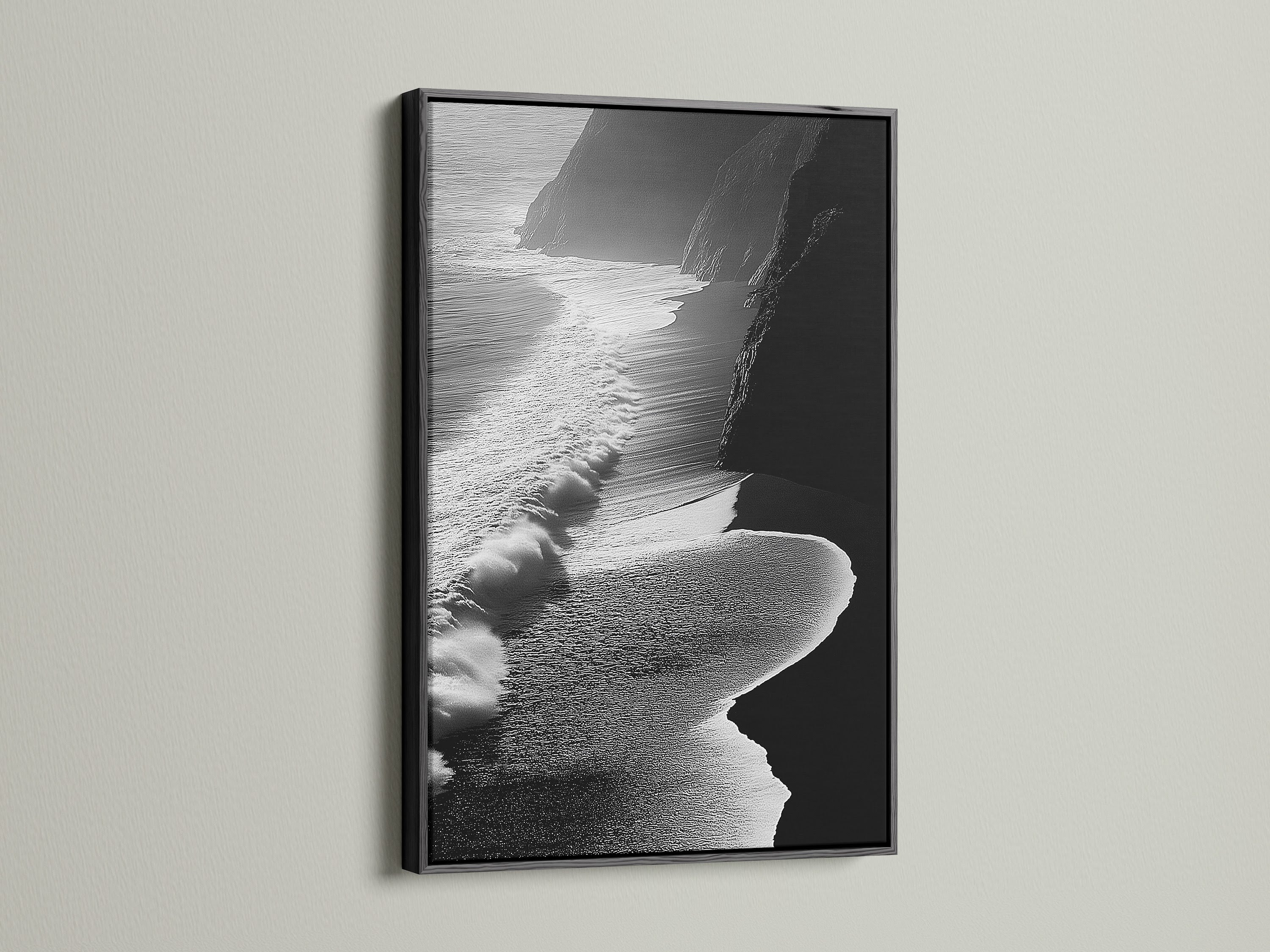 A striking black and white ocean waves artwork is showcased. It is framed in classic black. This piece adds a touch of modern elegance to any space. The aerial beach photography captures the ocean's beauty. The black frame provides a bold contrast. It is perfect for contemporary and minimalist styles. Elevate your living room or bedroom decor with this artwork.